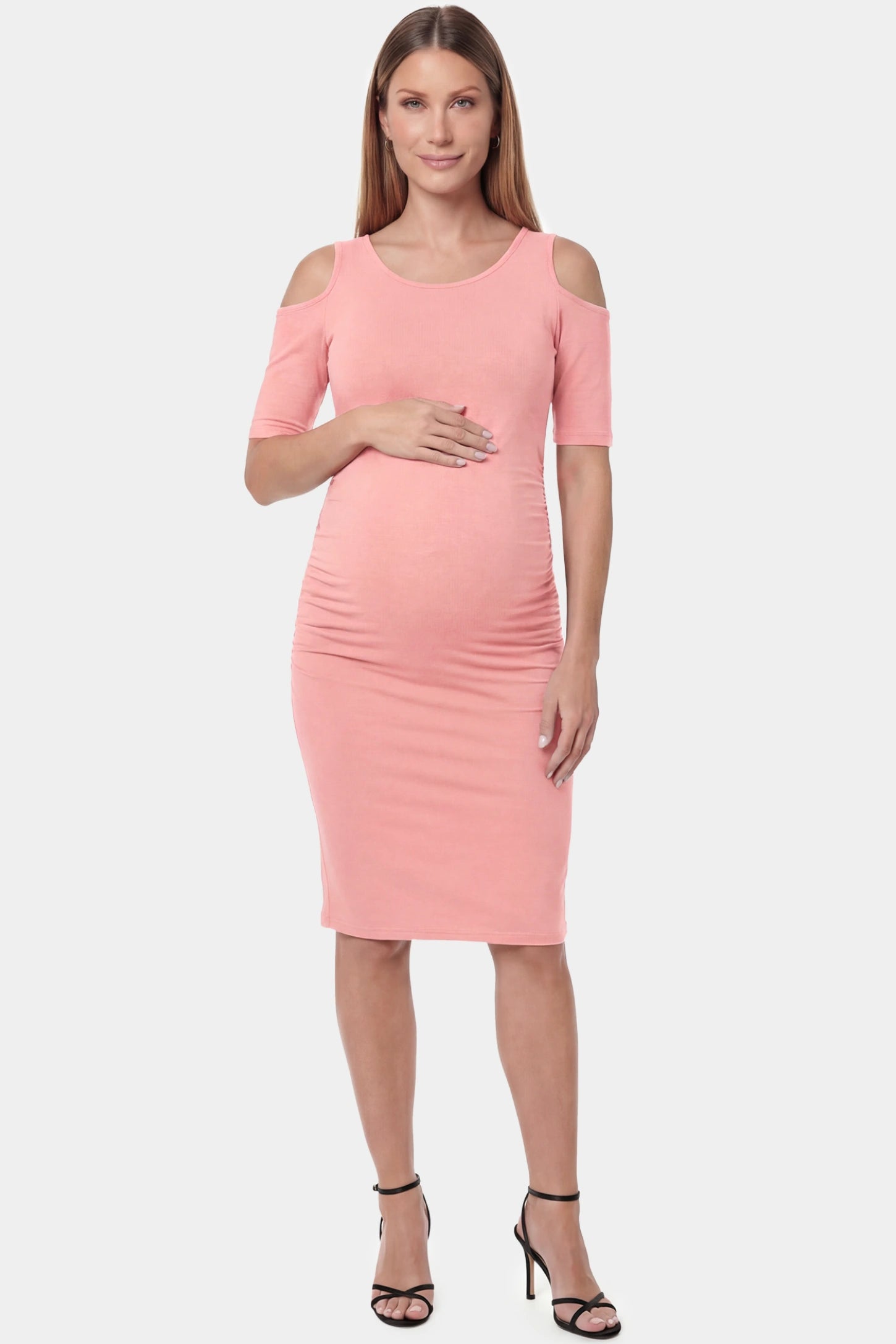Cold shoulder sleeve fitted short maternity dress in pink featuring soft stretch fabric in full body front view on a pregnant model