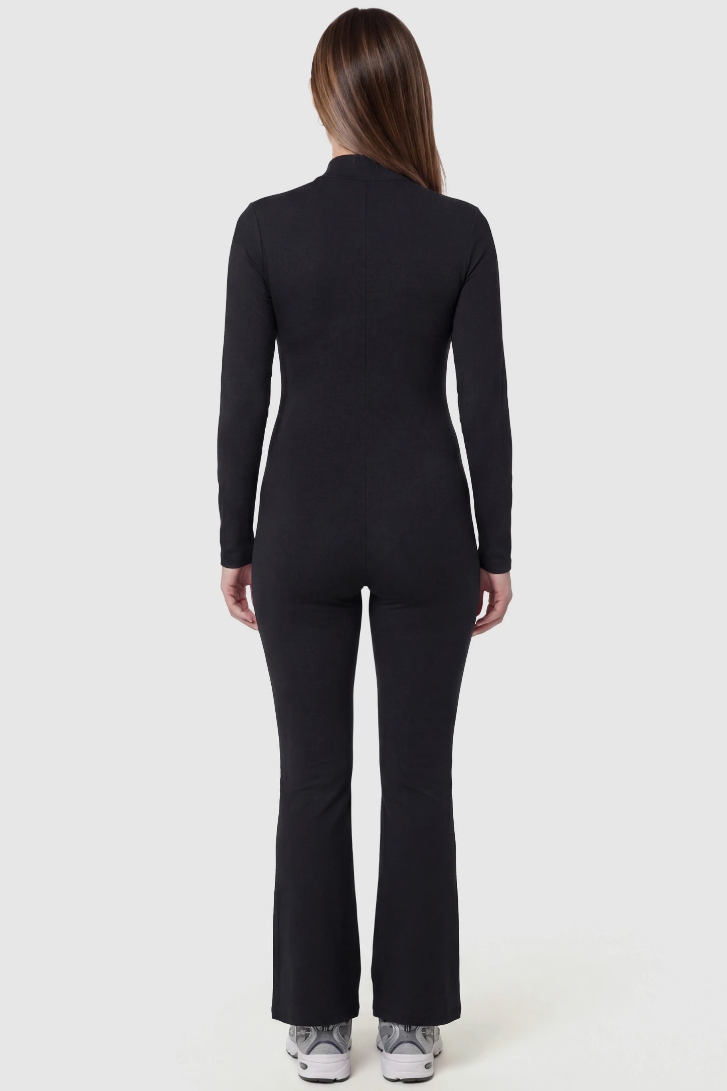 Collared Zip-Front Flared Maternity Jumpsuit Collared Zip-Front Flared Maternity Jumpsuit in Black featuring a figure shaping silhouette on a pregnant model, back view.
