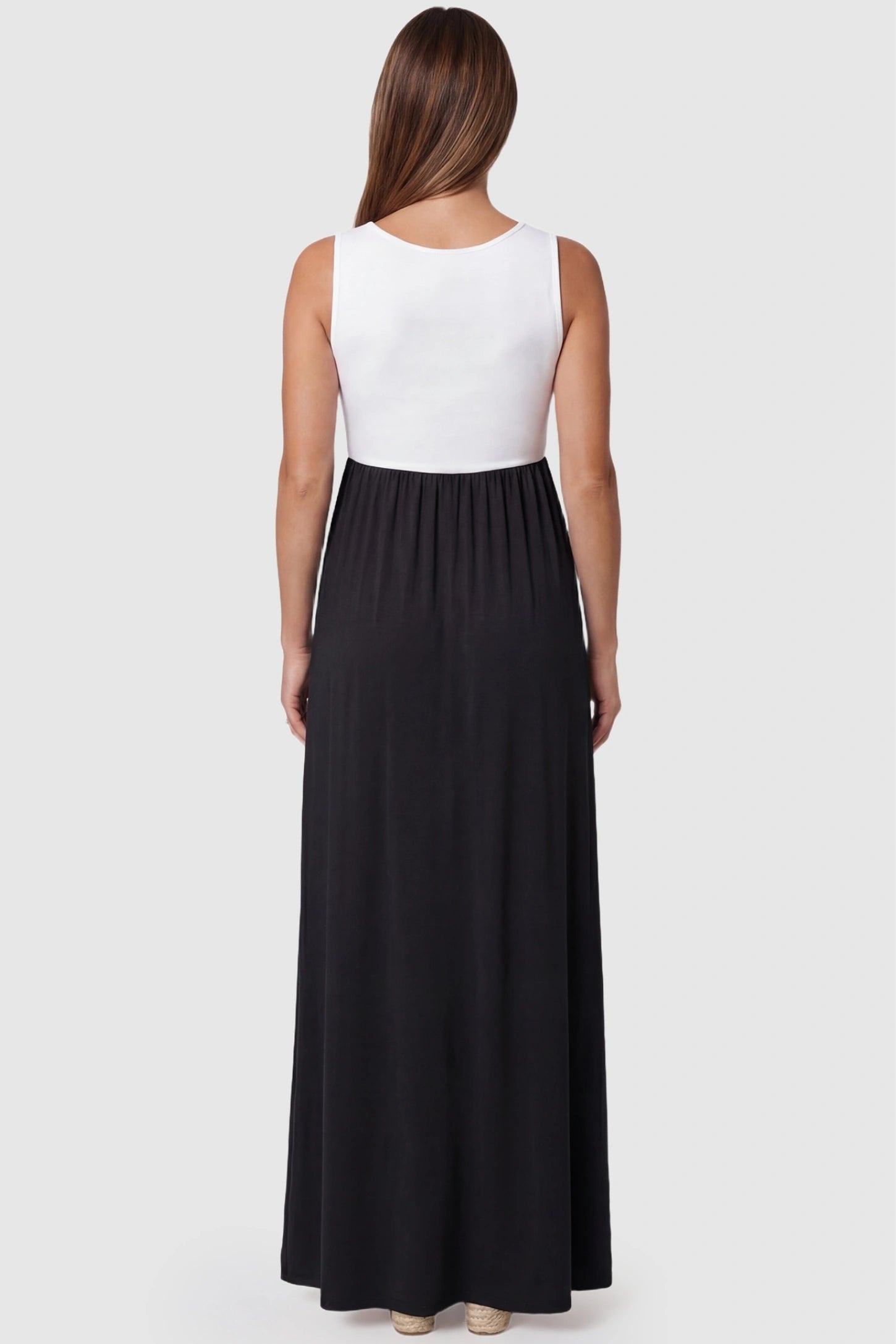 Color-Block Sleeveless Maternity Maxi Dress Color-Block Sleeveless Maternity Maxi Dress in Black featuring a scoop back detail on a pregnant model.
