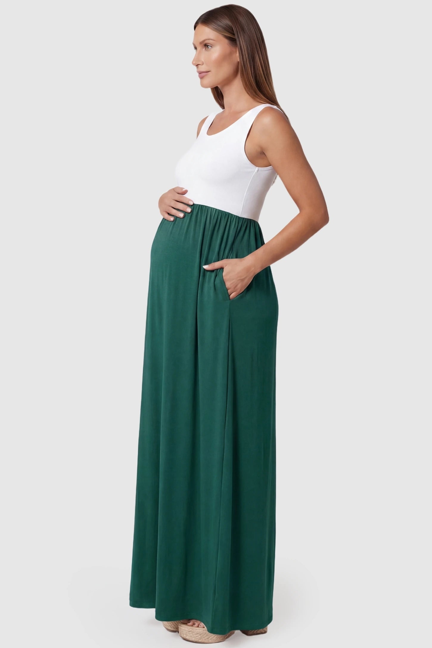 Color-Block Sleeveless Maternity Maxi Dress Color-Block Sleeveless Maternity Maxi Dress in Olive Green featuring a floor-length hem on a pregnant model.