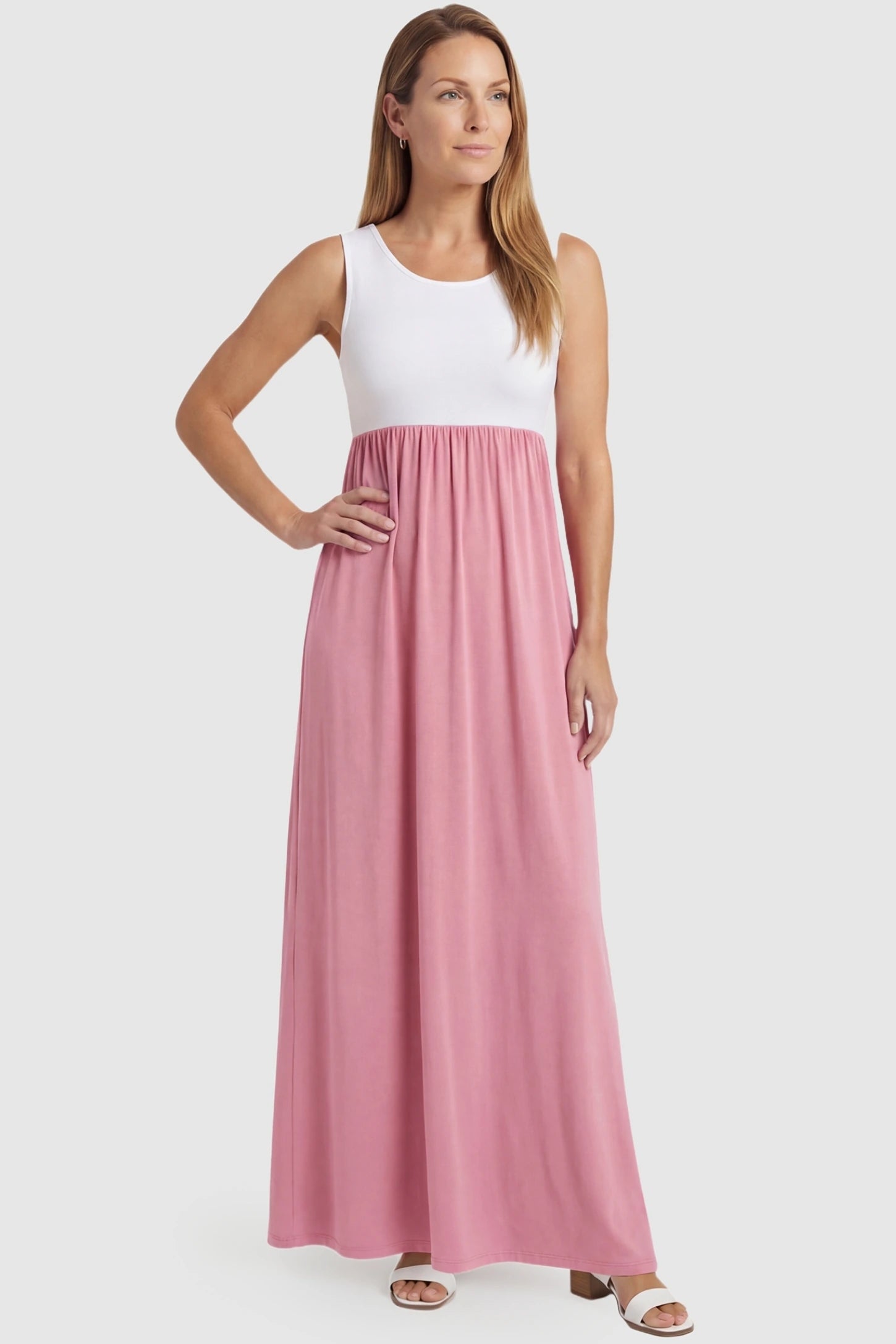 Color-Block Sleeveless Maternity Maxi Dress Color-Block Sleeveless Maternity Maxi Dress in Pink featuring a flattering maxi length on a non-pregnant model.