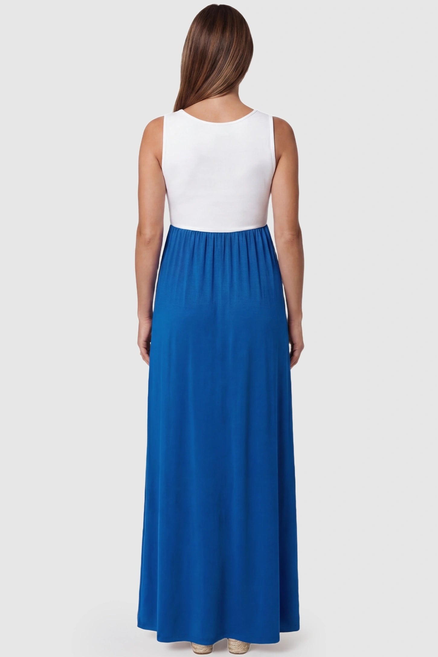 Color-Block Sleeveless Maternity Maxi Dress Color-Block Sleeveless Maternity Maxi Dress in Royal Blue featuring a racerback design on a pregnant model.