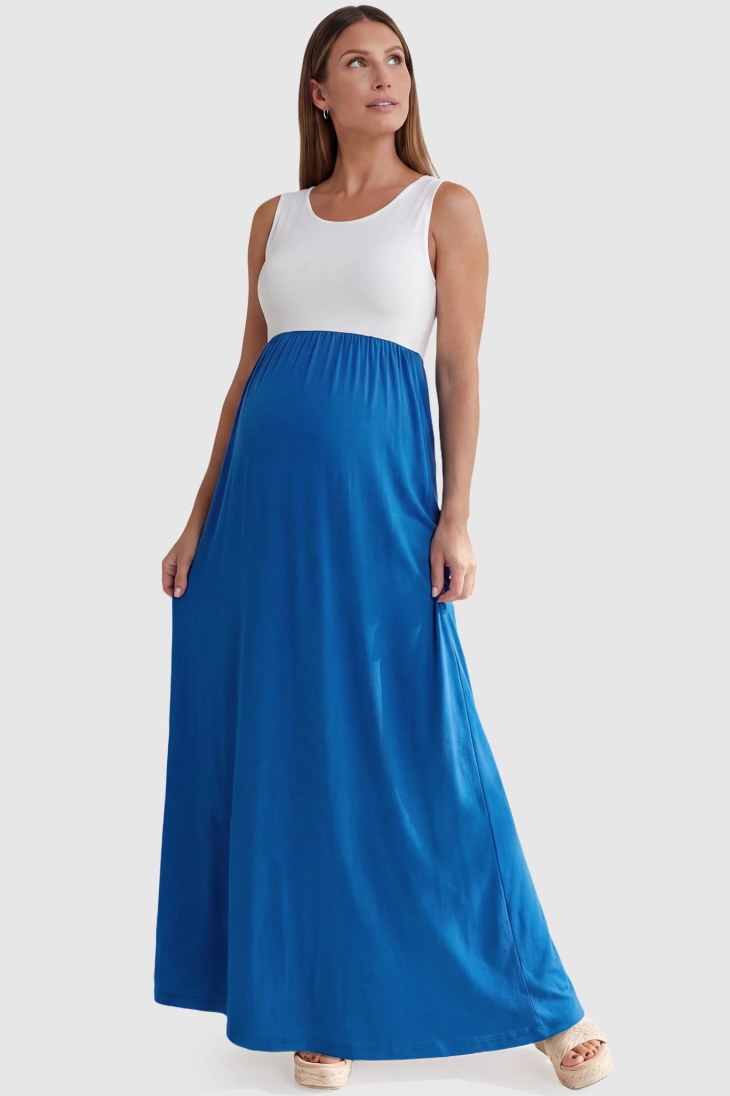 Color-Block Sleeveless Maternity Maxi Dress in Royal Blue featuring a scoop neckline on a pregnant model.
