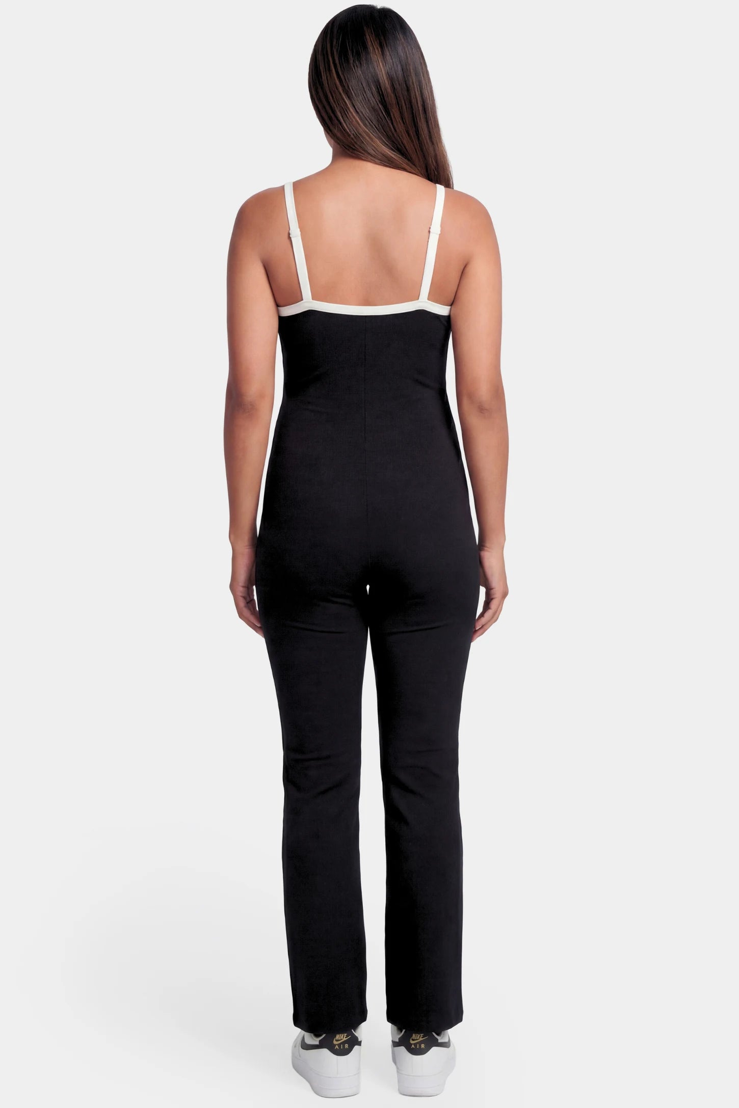 Scoop Neck Contrast Trim Maternity Jumpsuit Scoop Neck Contrast Trim Maternity Jumpsuit in black featuring spaghetti straps and contrast trim on a pregnant model.