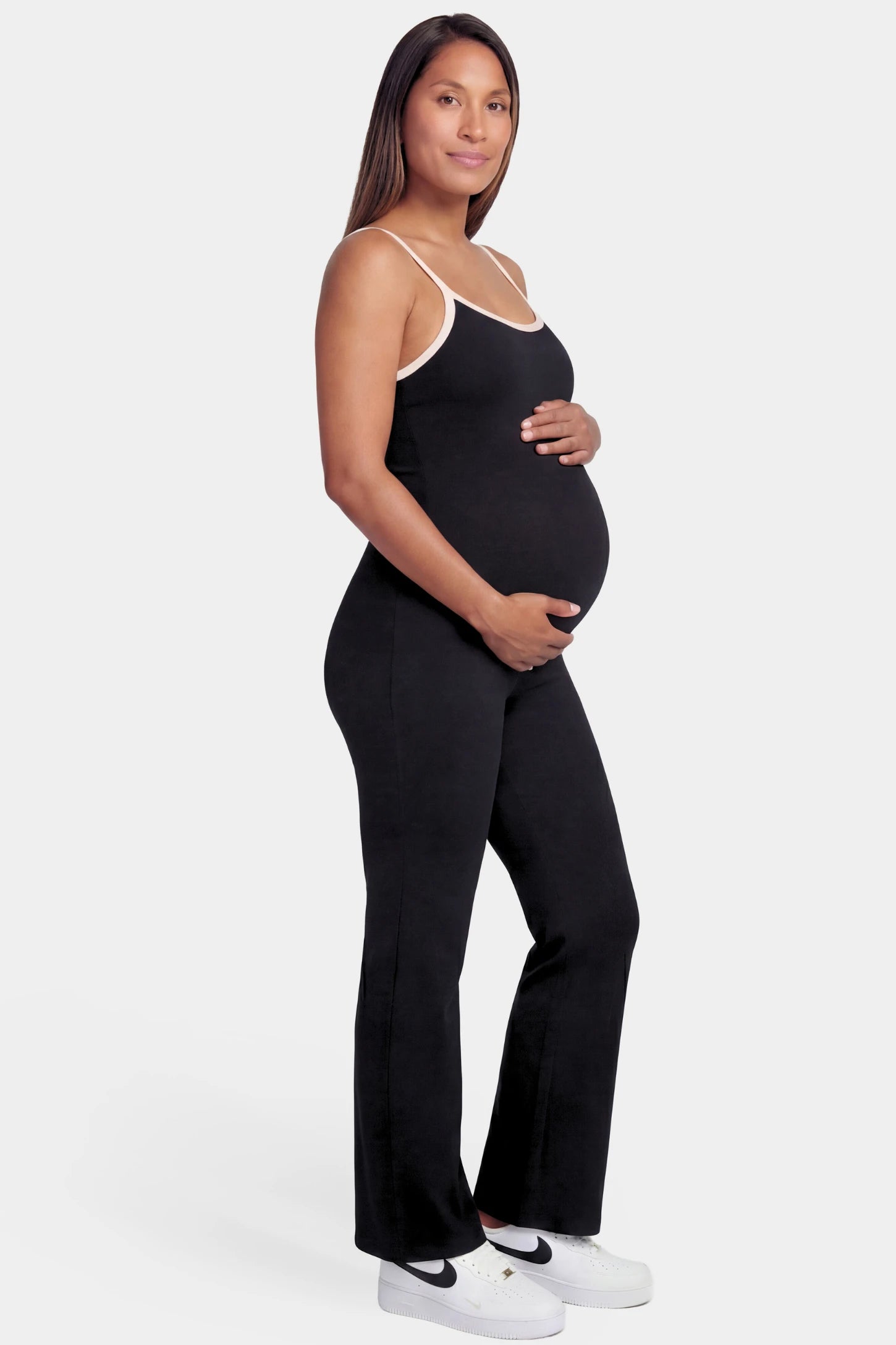 Scoop Neck Contrast Trim Maternity Jumpsuit in black featuring spaghetti straps and contrast trim on a pregnant model.