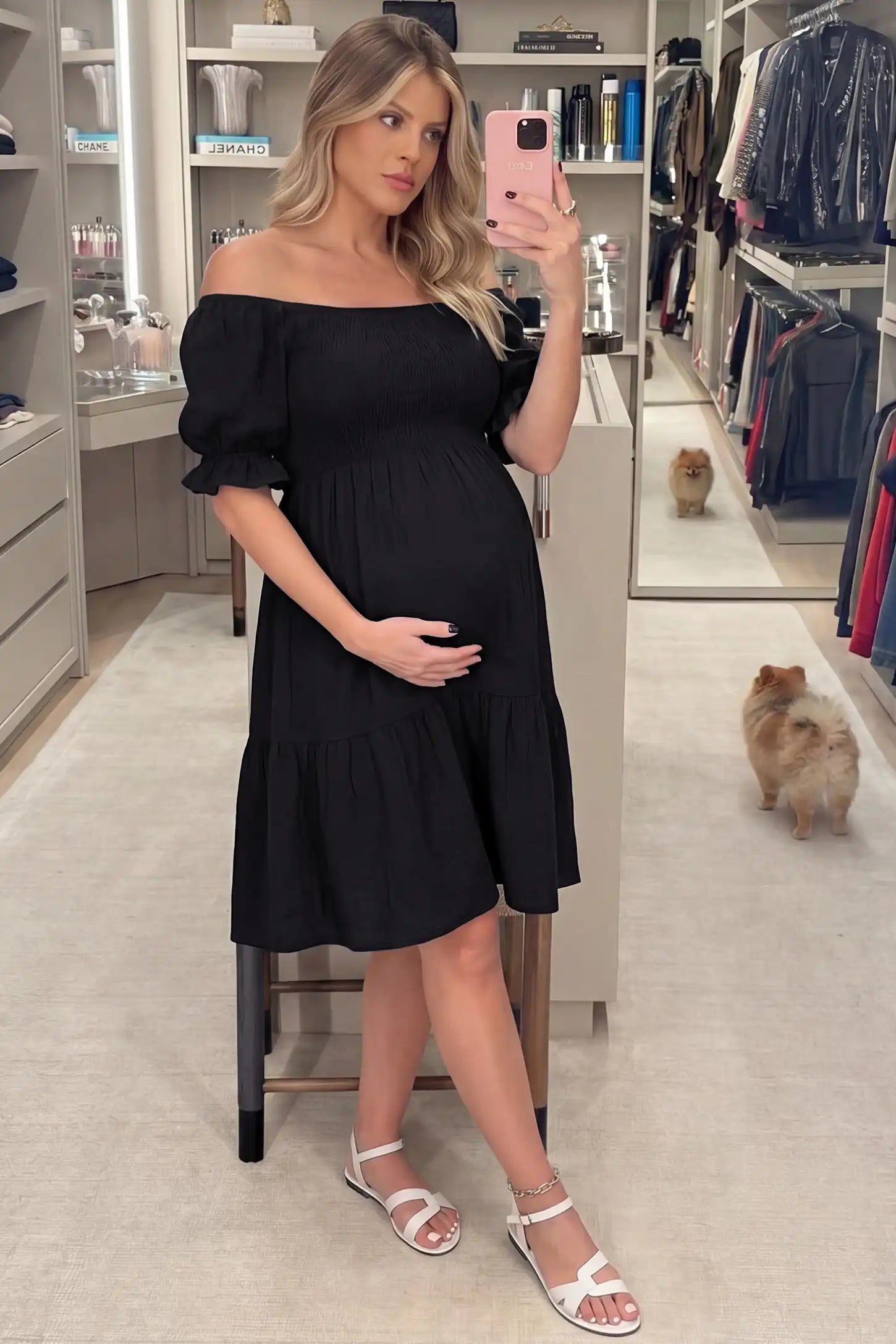 Smocked Off-Shoulder Empire Waist Maternity Short Dress Smocked off-shoulder empire waist maternity short dress in black with smocked bodice detail, front view on pregnant model