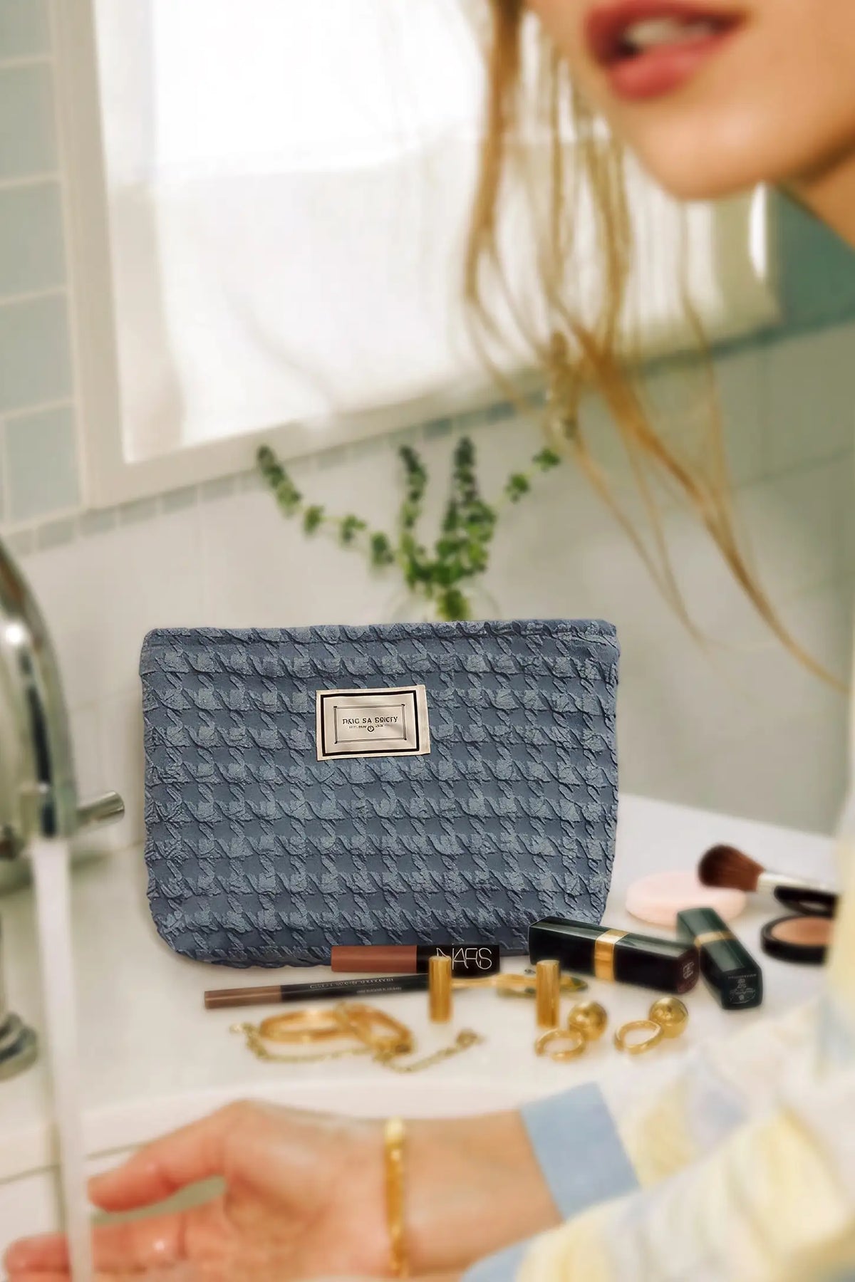 Corduroy Color-Block Travel Pouch Corduroy Color-Block Travel Pouch in Slate Blue holding cosmetics and skincare essentials on a bathroom counter, lifestyle view.