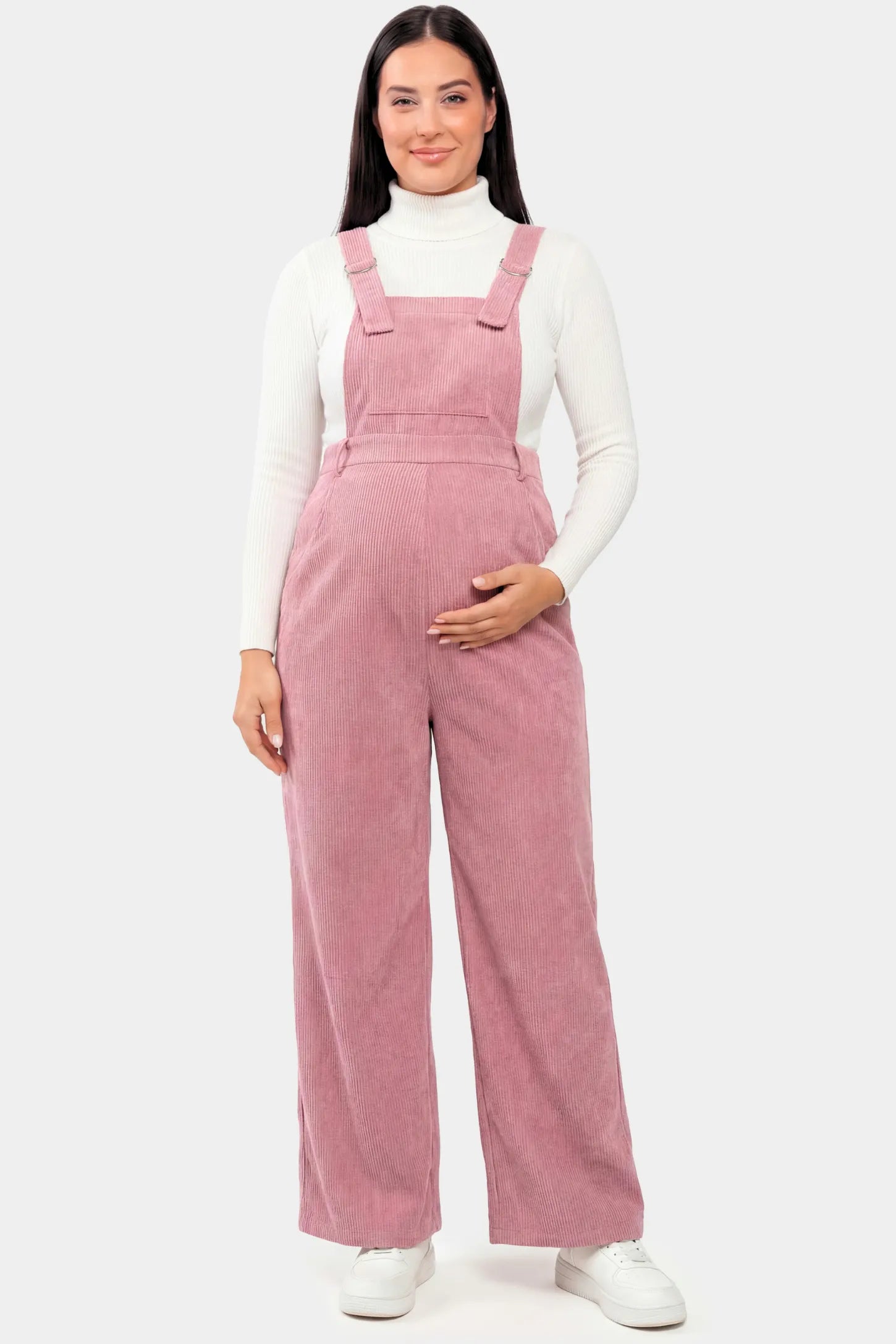 Corduroy Wide-Leg Maternity Jumpsuit in Pink featuring a relaxed wide-leg silhouette on a pregnant model.
