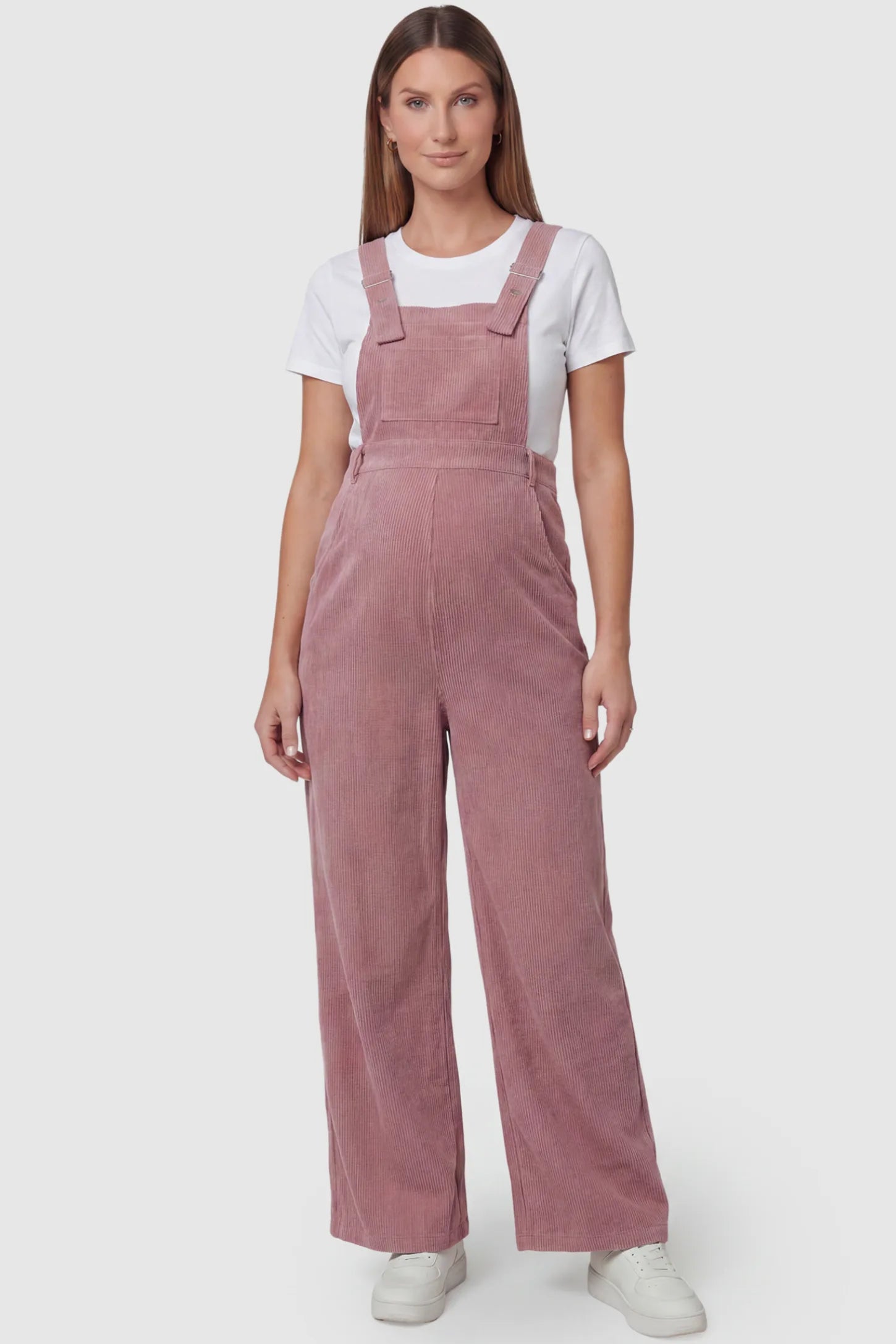 Corduroy Wide-Leg Maternity Jumpsuit in Pink featuring a relaxed wide-leg silhouette on a pregnant model, front view.