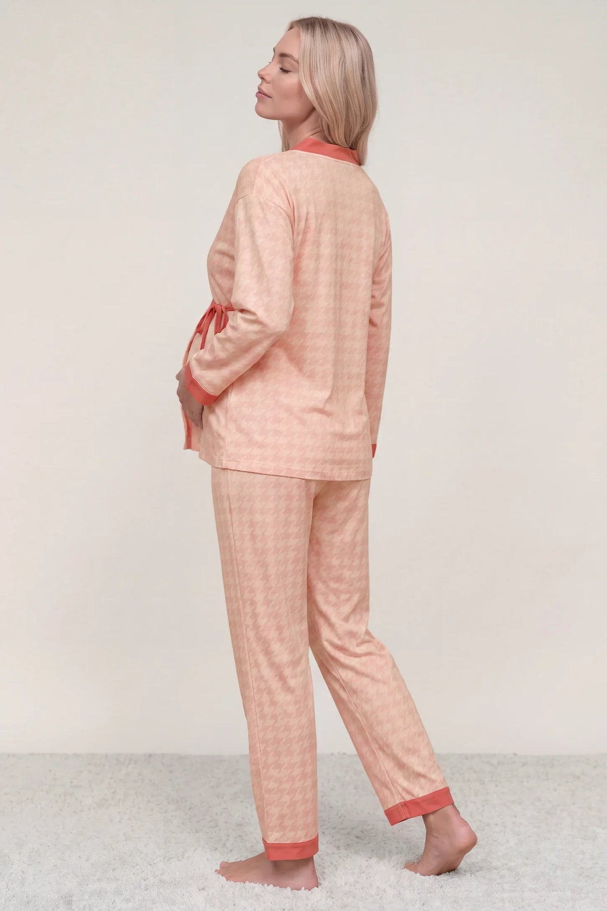 Cotton Houndstooth Nursing Pajama Set Cotton Houndstooth Nursing Pajama Set in Pink Houndstooth featuring full back coverage, soft cotton-rich fabric, relaxed fit, and matching long pants on a pregnant model, back view.