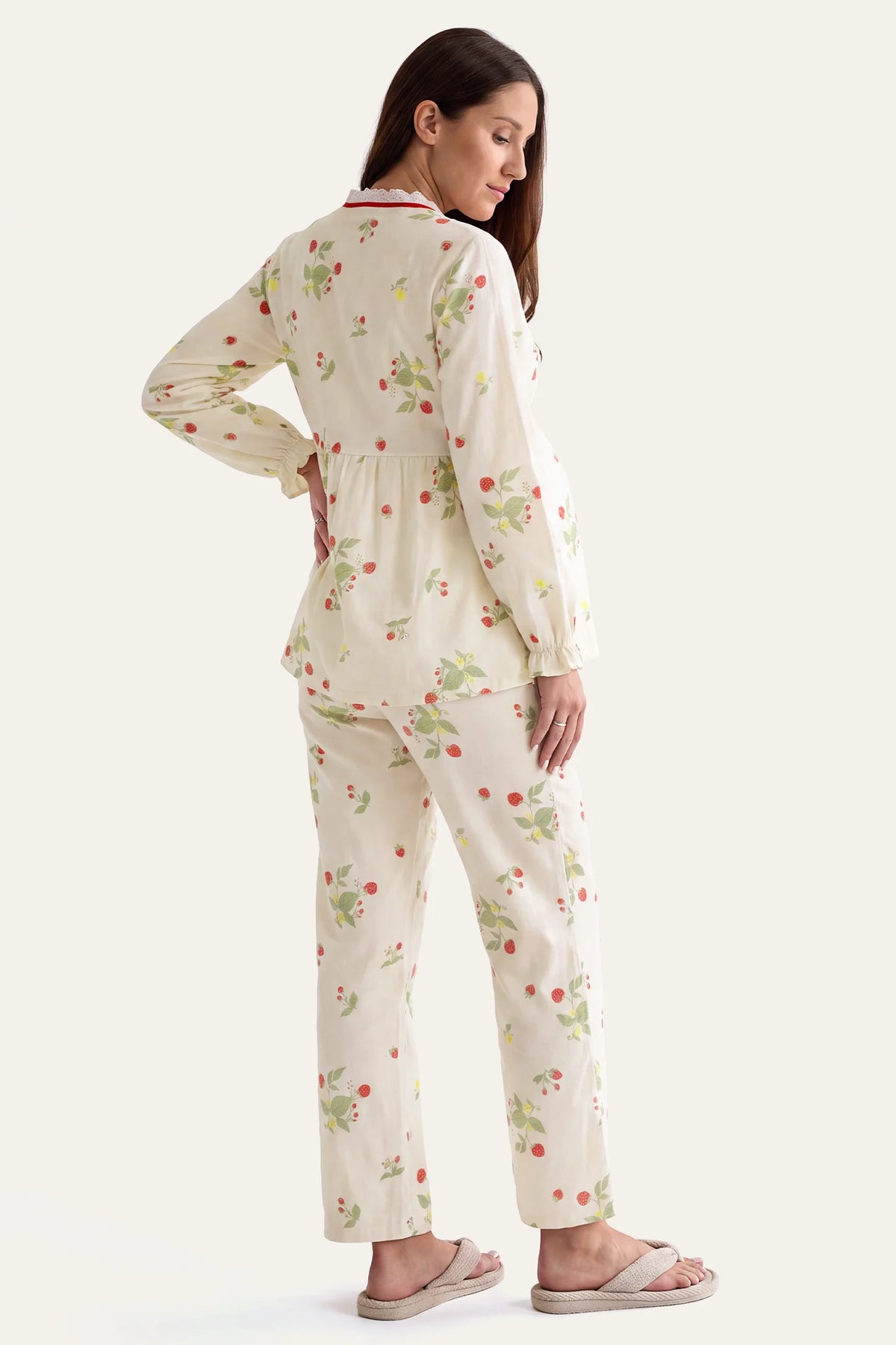 Cotton Long Sleeve Top & Pants Maternity Pajama Set Full back view of a standing pregnant model wearing the Cotton Long Sleeve Top & Pants Maternity Pajama Set in Strawberry print against a clean off-white studio background.