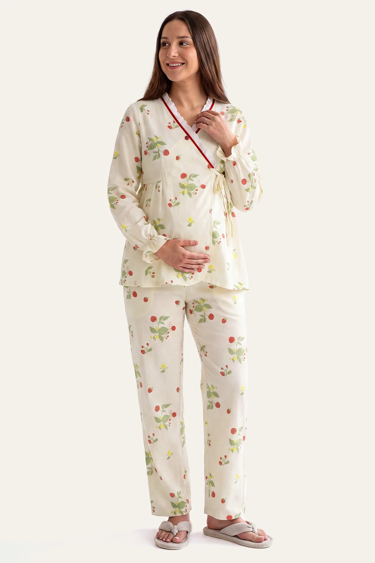 Cotton Long Sleeve Top & Pants Maternity Pajama Set Full front view of a pregnant model wearing the Strawberry print maternity pajama set with a side-tie wrap closure top and elasticized waistband trousers.