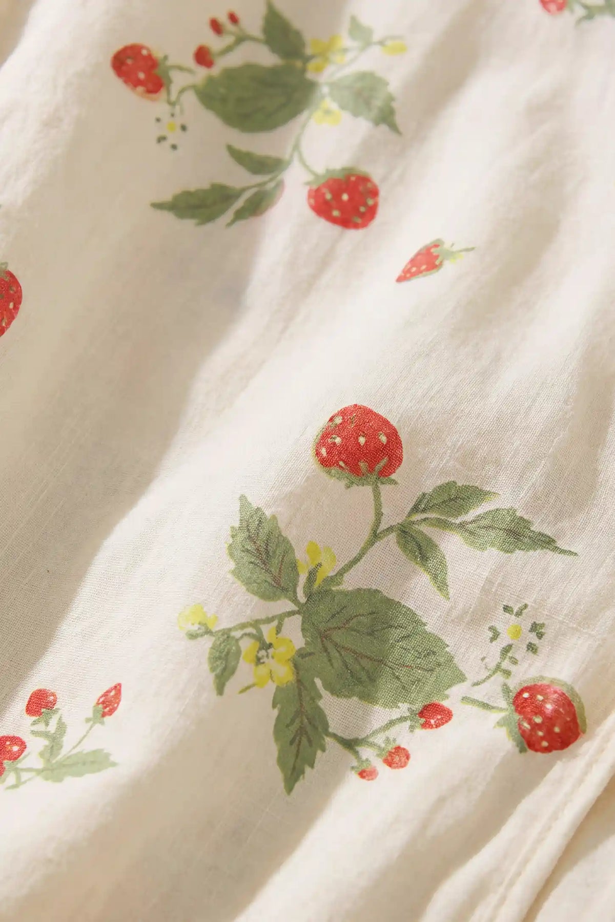 Cotton Long Sleeve Top & Pants Maternity Pajama Set Macro close-up shot of the soft 100% pure cotton breathable fabric showing the delicate strawberry, green leaf, and yellow blossom pattern.