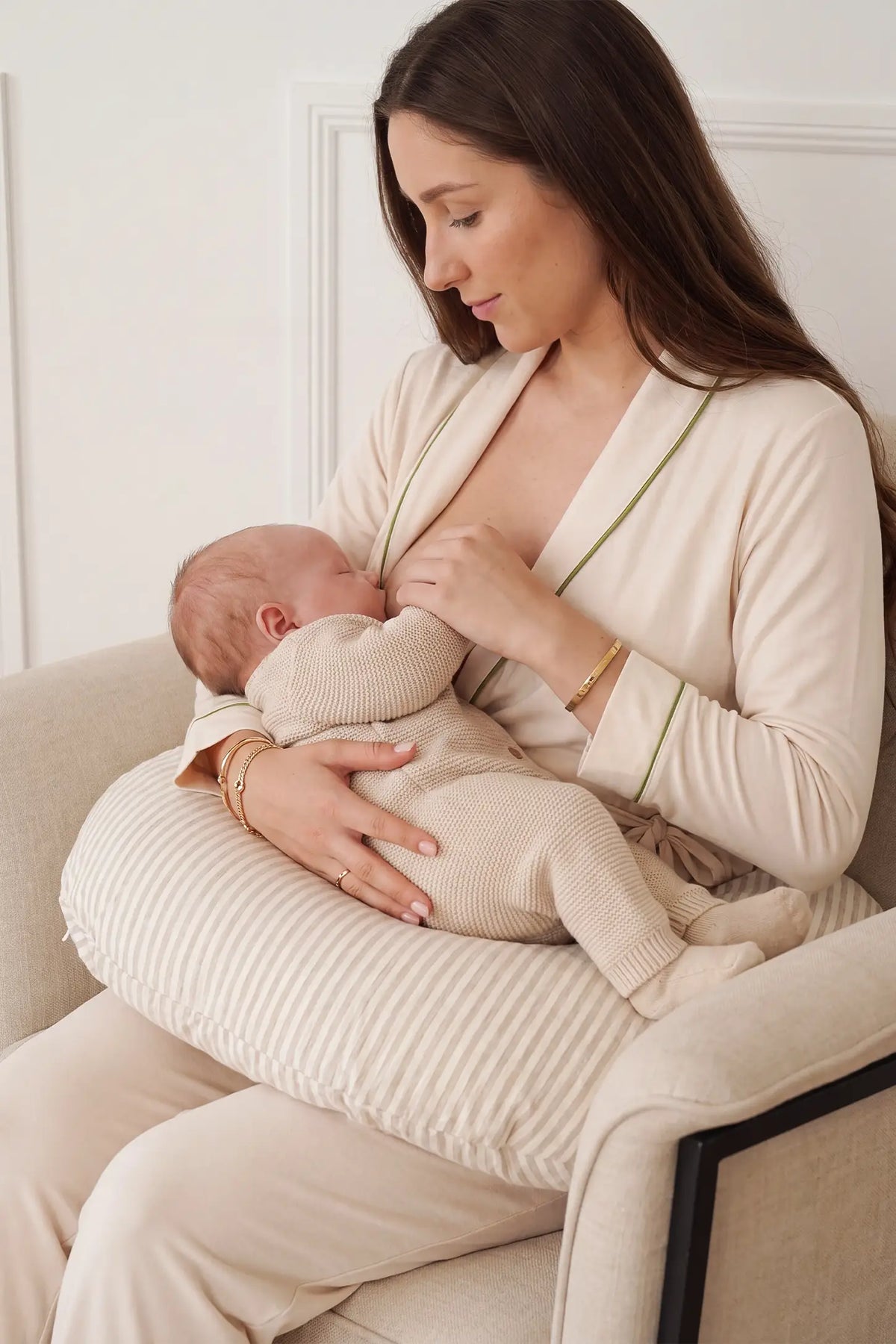 Cotton Wrap Front Long Sleeve Top Wide Leg Pants Maternity Sleepwear Cotton Wrap Front Long Sleeve Top Wide Leg Pants Maternity Sleepwear in Beige featuring soft cotton fabric, comfortable long sleeves, and wide-leg pants on a pregnant model enjoying a relaxed indoor setting.