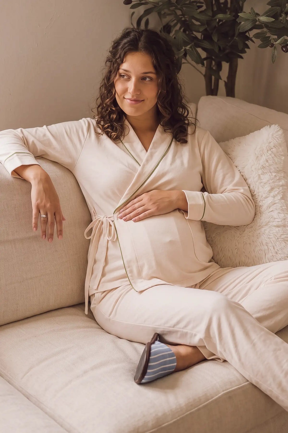 Cotton Wrap Front Long Sleeve Top Wide Leg Pants Maternity Sleepwear Cotton Wrap Front Long Sleeve Top Wide Leg Pants Maternity Sleepwear in Beige featuring a comfortable wrap front top and relaxed wide-leg pants on a pregnant model in a cozy lifestyle setting.