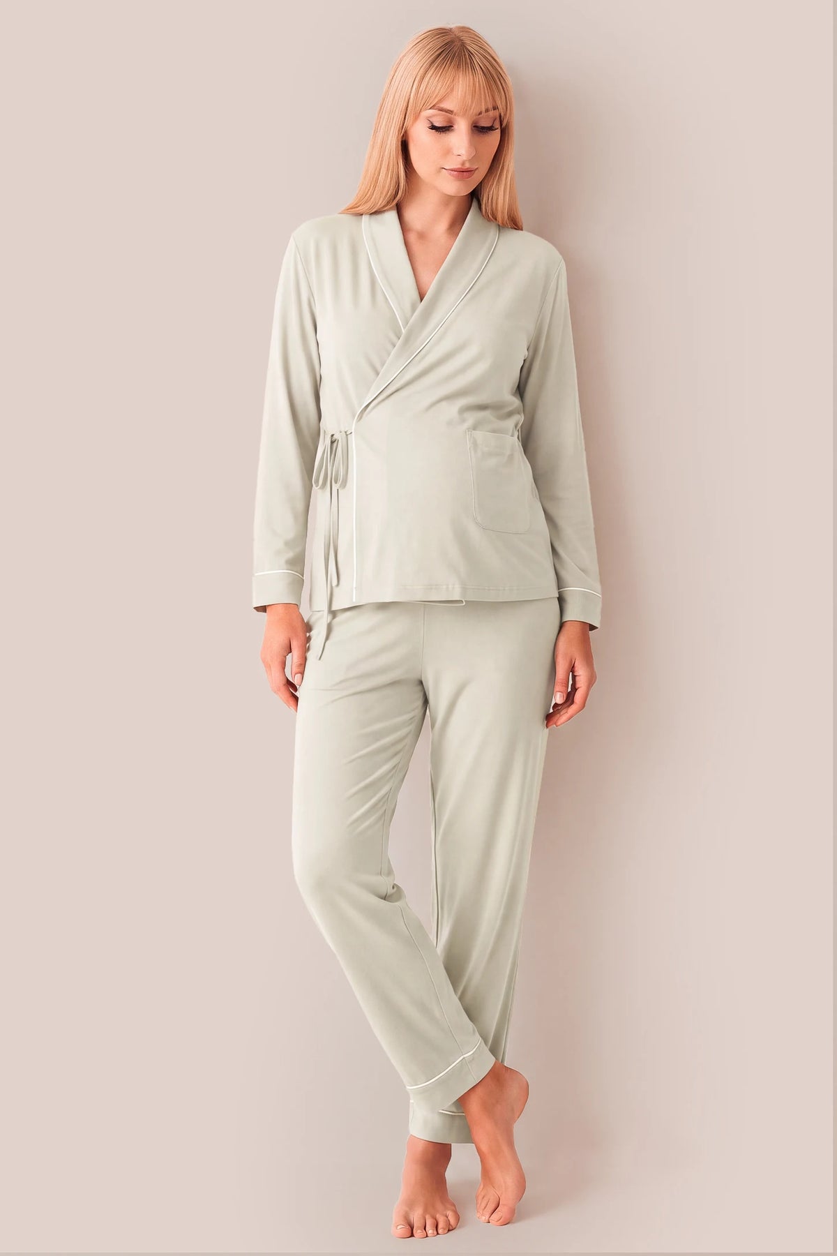 Cotton Wrap Front Long Sleeve Top Wide Leg Pants Maternity Sleepwear Cotton Wrap Front Long Sleeve Top Wide Leg Pants Maternity Sleepwear in Light Green featuring a comfortable wrap front neckline, relaxed sleeve openings, built-in bust support, neatly folded hems, and an adjustable waist fit on a pregnant model, front view.