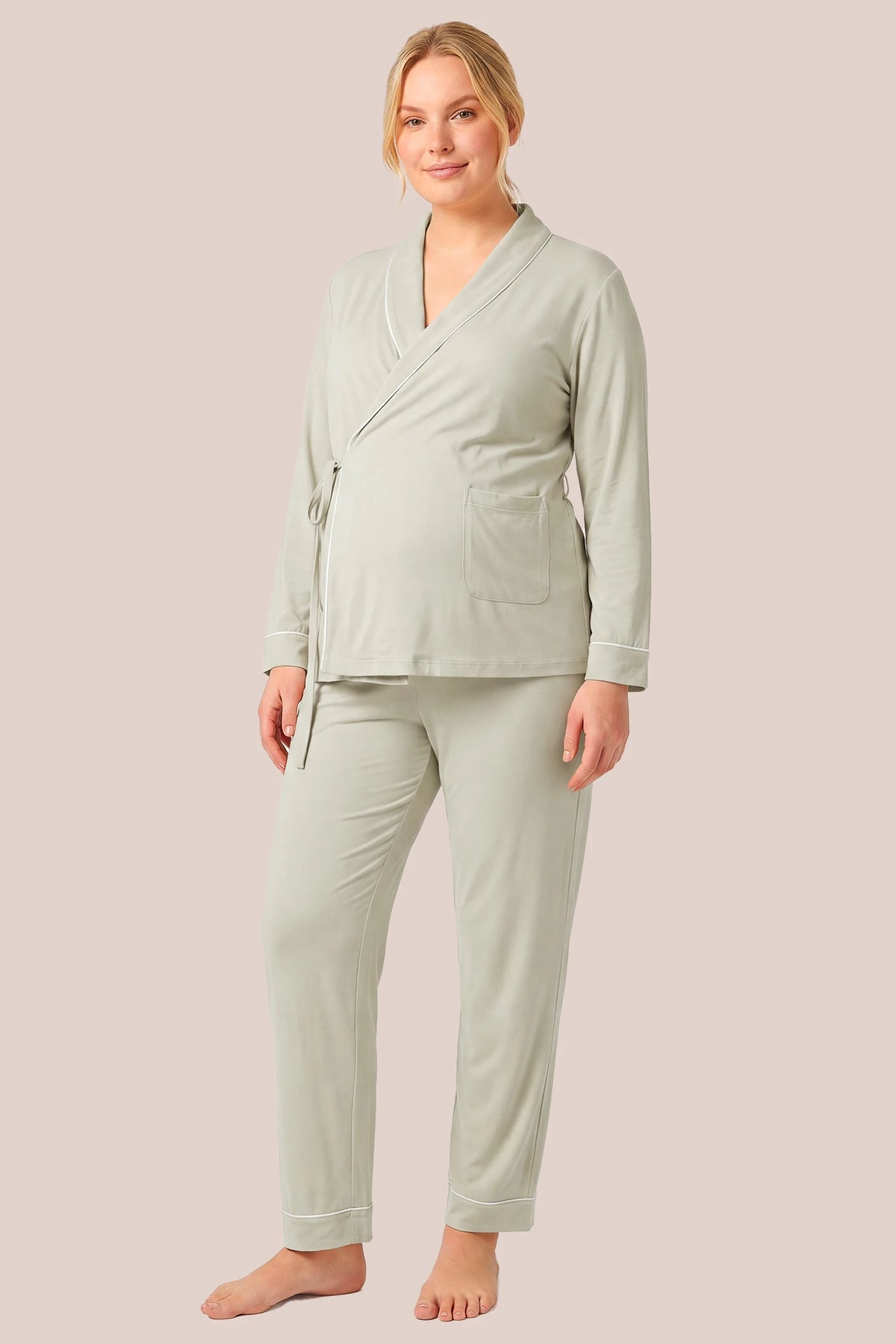 Cotton Wrap Front Long Sleeve Top Wide Leg Pants Maternity Sleepwear Cotton Wrap Front Long Sleeve Top Wide Leg Pants Maternity Sleepwear in Light Green featuring a wrap front neckline, built-in bust support, adjustable waist fit, and relaxed wide-leg silhouette on a plus-size pregnant model, front view.