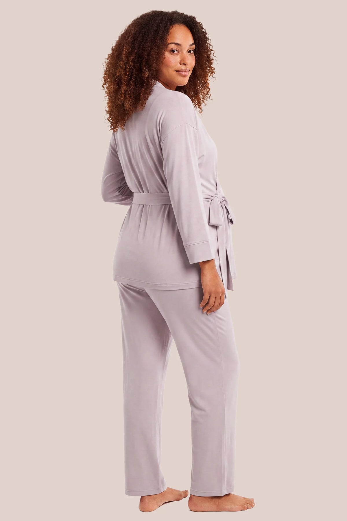 Cotton Wrap Front Long Sleeve Top Wide Leg Pants Maternity Sleepwear Cotton Wrap Front Long Sleeve Top Wide Leg Pants Maternity Sleepwear in Light Purple featuring a relaxed back design, long sleeves, wide-leg pants, and a comfortable maternity-friendly silhouette on a pregnant model, back view.