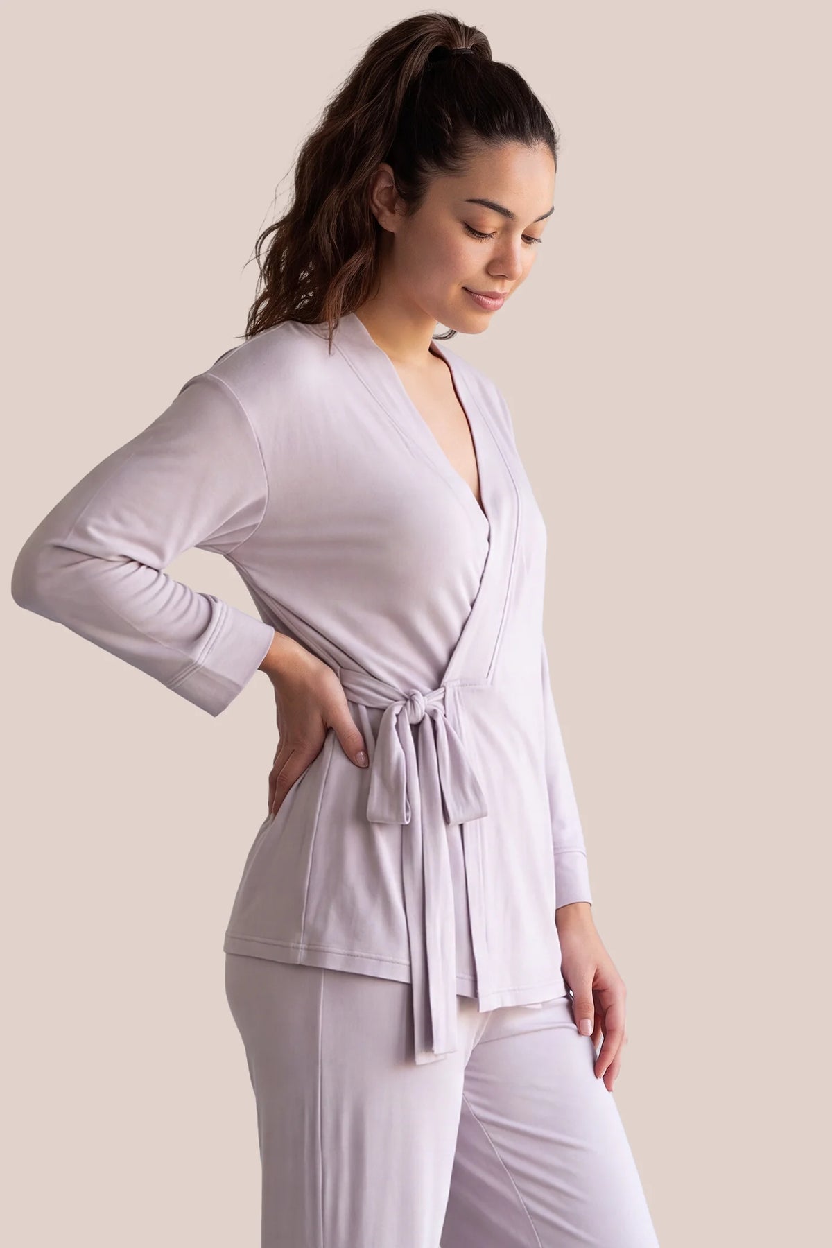 Cotton Wrap Front Long Sleeve Top Wide Leg Pants Maternity Sleepwear Cotton Wrap Front Long Sleeve Top Wide Leg Pants Maternity Sleepwear in Light Purple featuring a comfortable wrap front neckline, built-in bust support, adjustable waist fit, and relaxed silhouette on a postpartum model, front view.