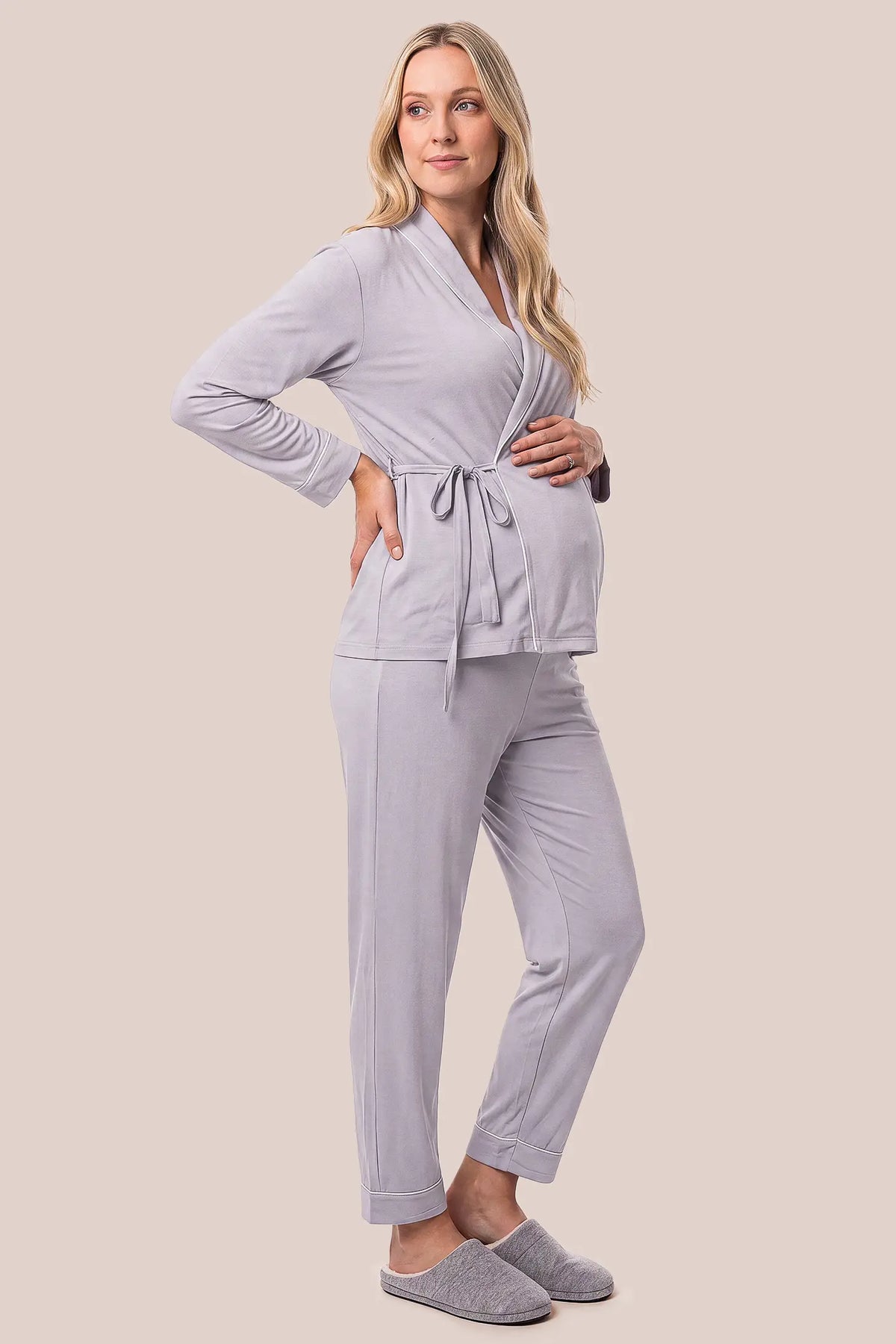 Cotton Wrap Front Long Sleeve Top Wide Leg Pants Maternity Sleepwear Cotton Wrap Front Long Sleeve Top Wide Leg Pants Maternity Sleepwear in Purple featuring a relaxed silhouette, adjustable waist fit, wide-leg pants, and comfortable long sleeves on a pregnant model, side view.