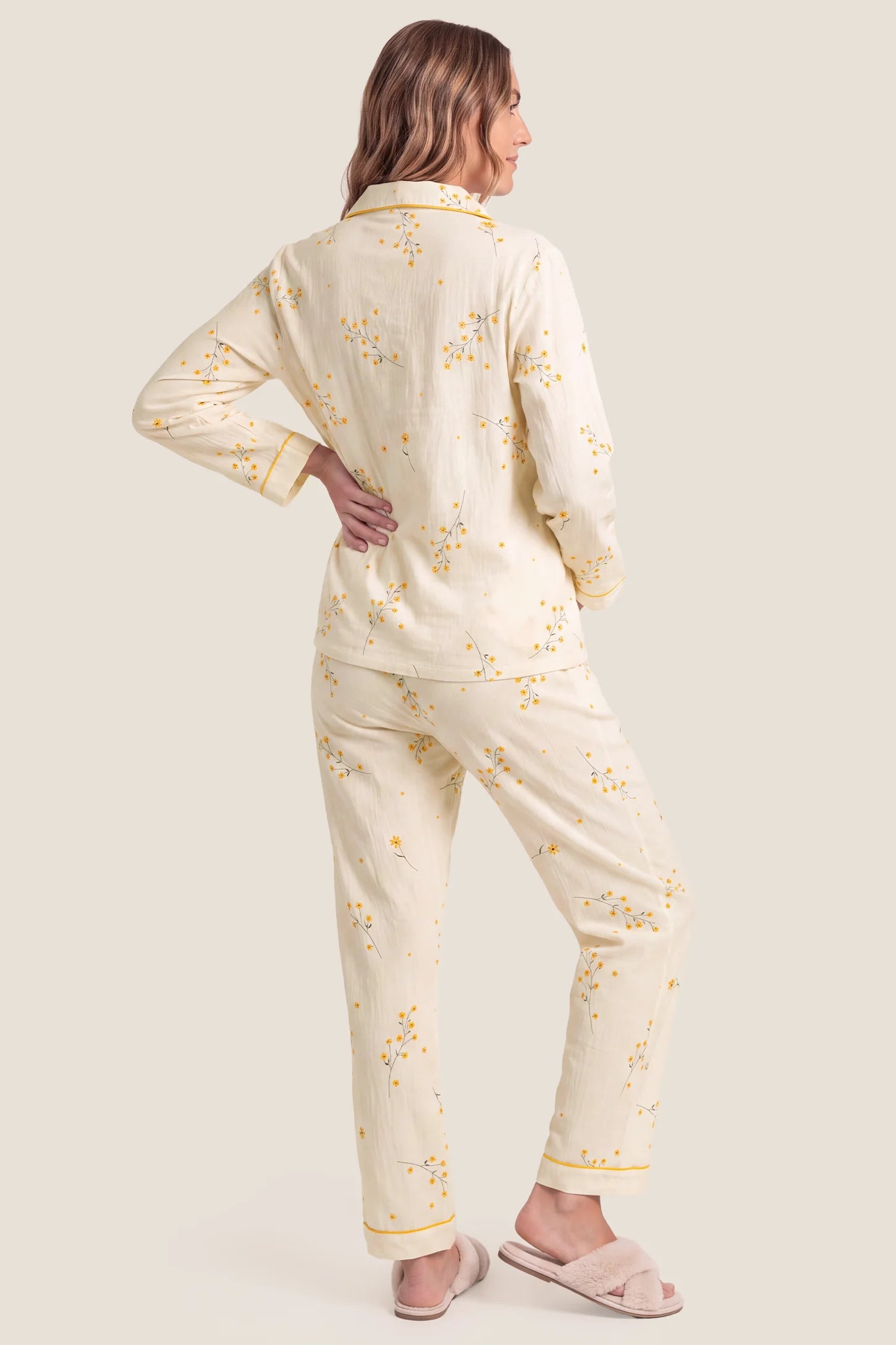 Cozy Floral Cotton Maternity Pajama Set Cozy Floral Cotton Maternity Pajama Set in Yellow Daisy featuring full back coverage, 100% lightweight cotton construction, long pants, and yellow trim on a pregnant model, back view.