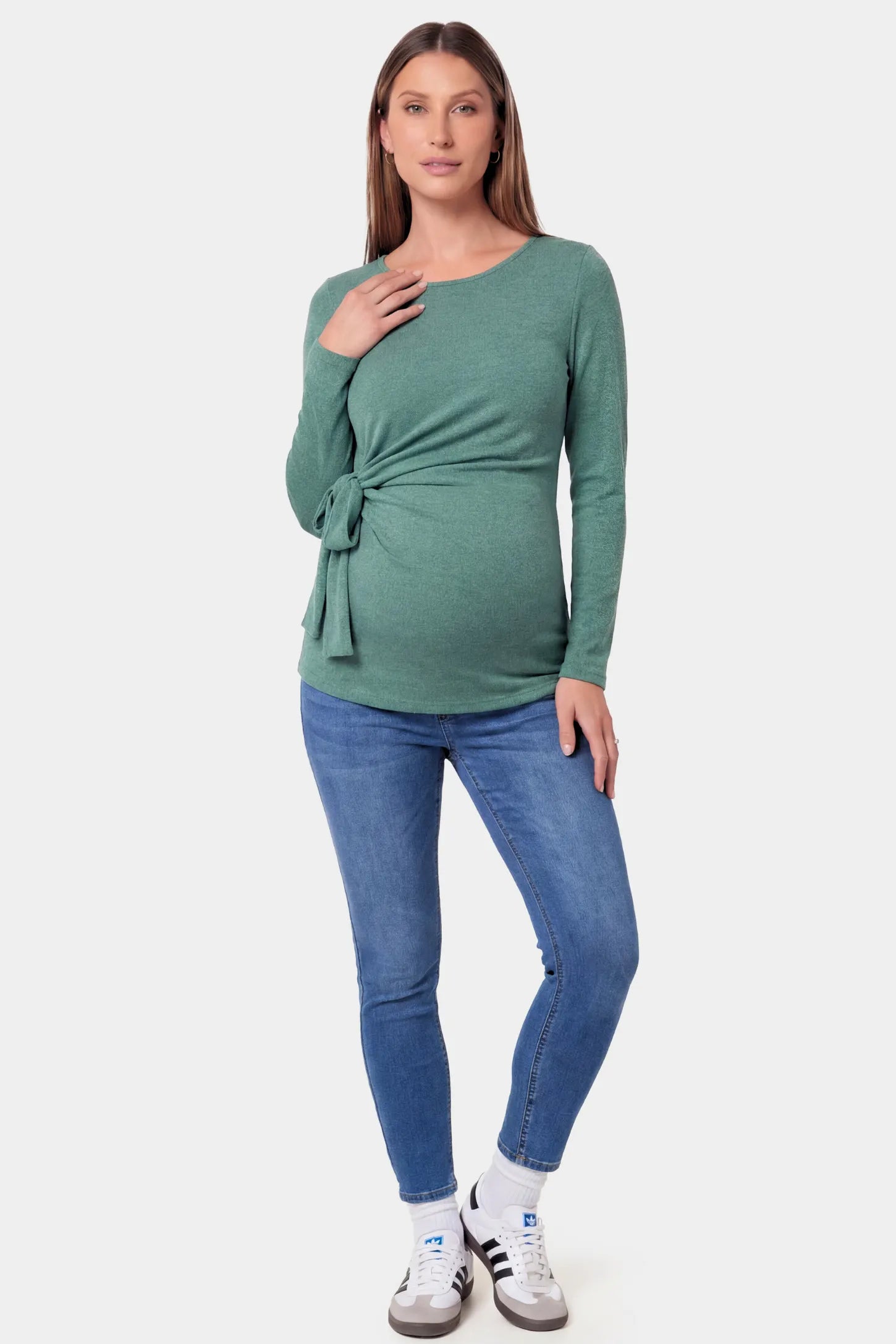 Crew Neck Long Sleeve with Side Tie Maternity Top Crew Neck Long Sleeve with Side Tie Maternity Top in green featuring an adjustable side tie and crew neckline on a pregnant model.