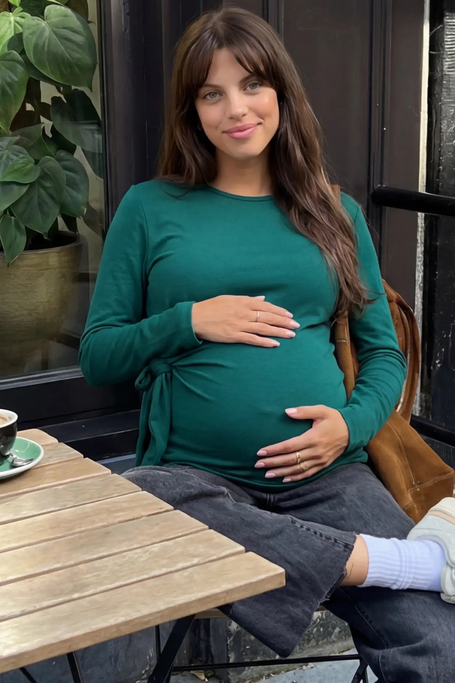 Crew Neck Long Sleeve with Side Tie Maternity Top Crew Neck Long Sleeve with Side Tie Maternity Top in green featuring an adjustable side tie and crew neckline on a pregnant model.
