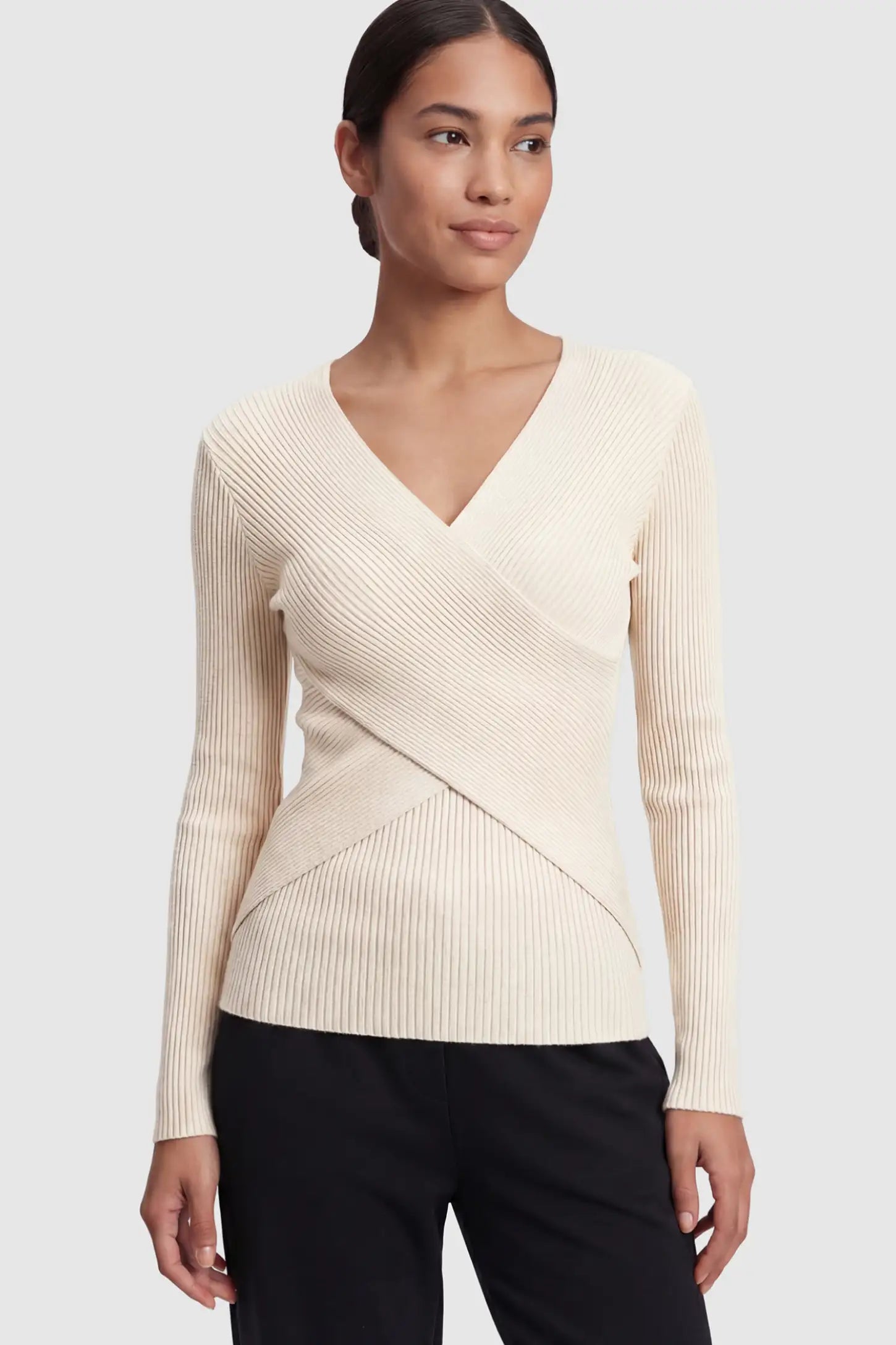 Cross-Over Ribbed Knit Maternity & Nursing Top Cross-Over Ribbed Knit Maternity & Nursing Top in Apricot featuring a wrap neckline and textured finish on a non-pregnant model.