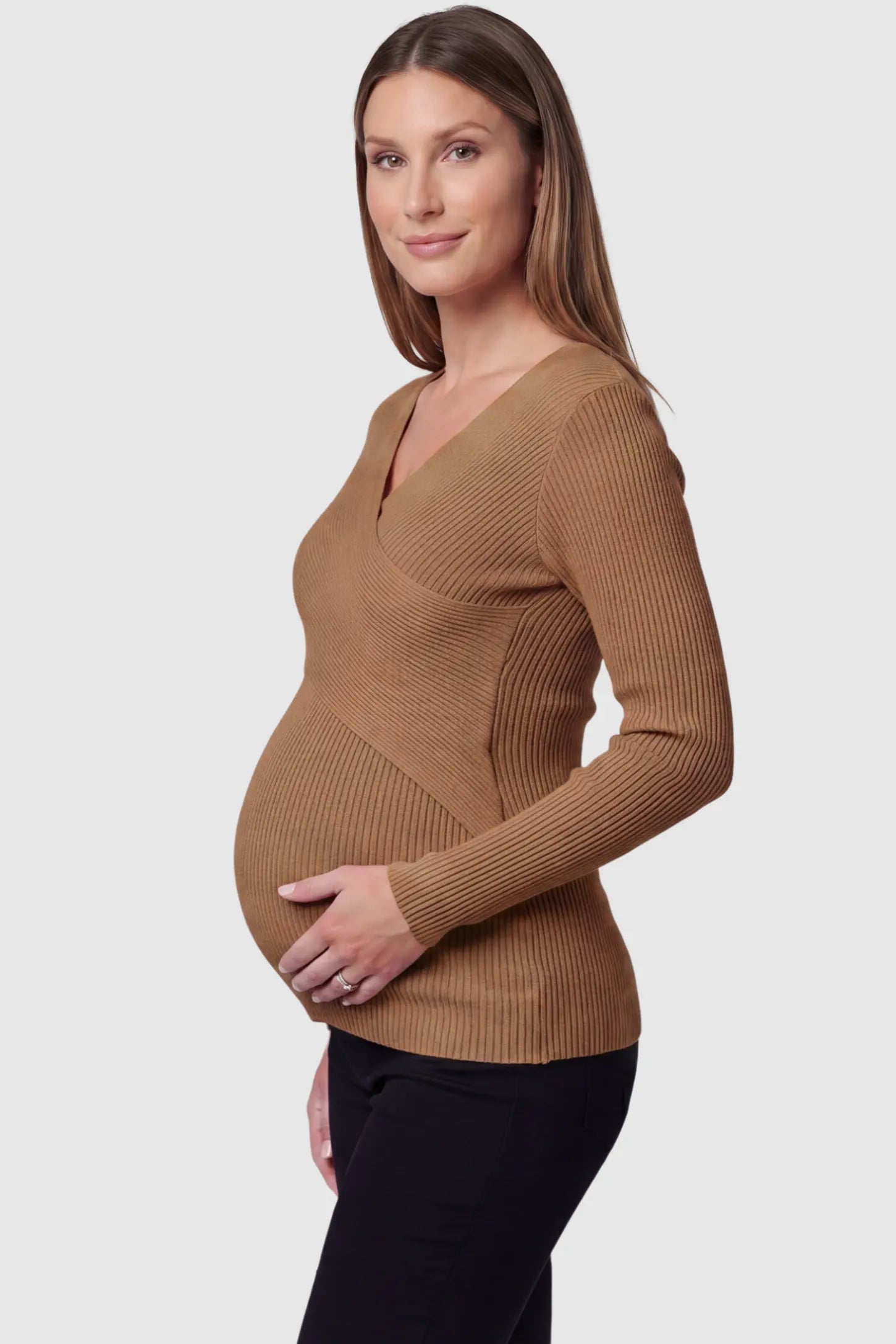 Cross-Over Ribbed Knit Maternity & Nursing Top in Coffee featuring a wrap neckline and textured finish on a pregnant model, side view.