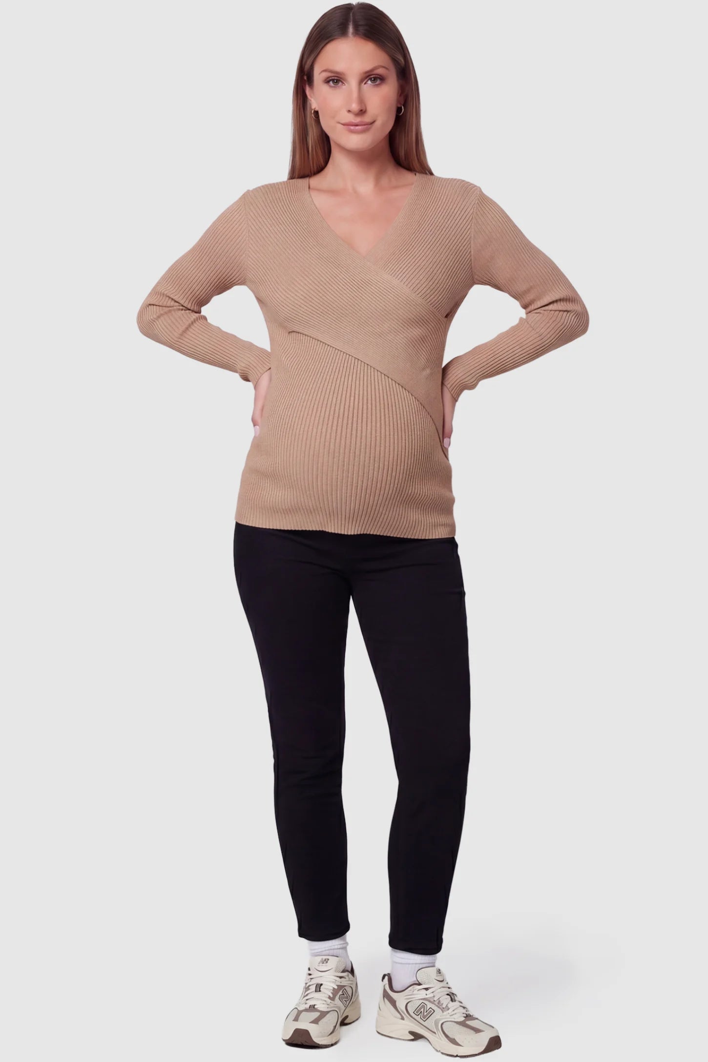 Cross-Over Ribbed Knit Maternity & Nursing Top Cross-Over Ribbed Knit Maternity & Nursing Top in Khaki featuring a wrap neckline and textured finish on a pregnant model, full body view.