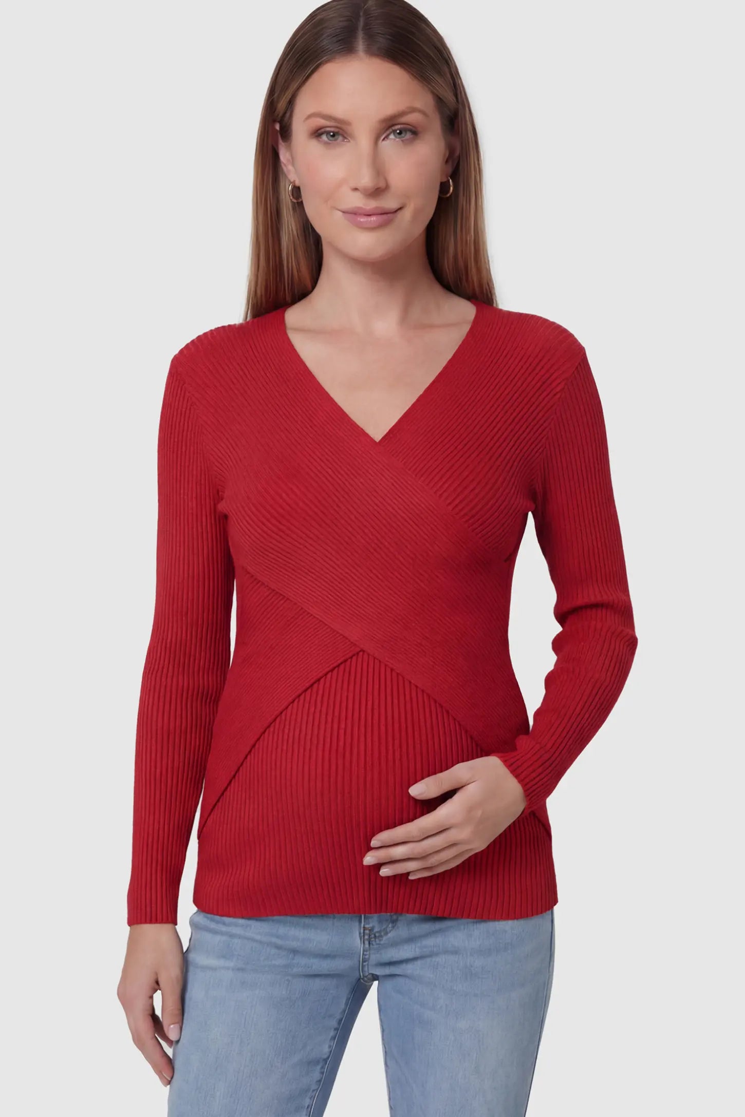 Cross-Over Ribbed Knit Maternity & Nursing Top Cross-Over Ribbed Knit Maternity & Nursing Top in Red featuring a wrap neckline and textured finish on a pregnant model, front view.