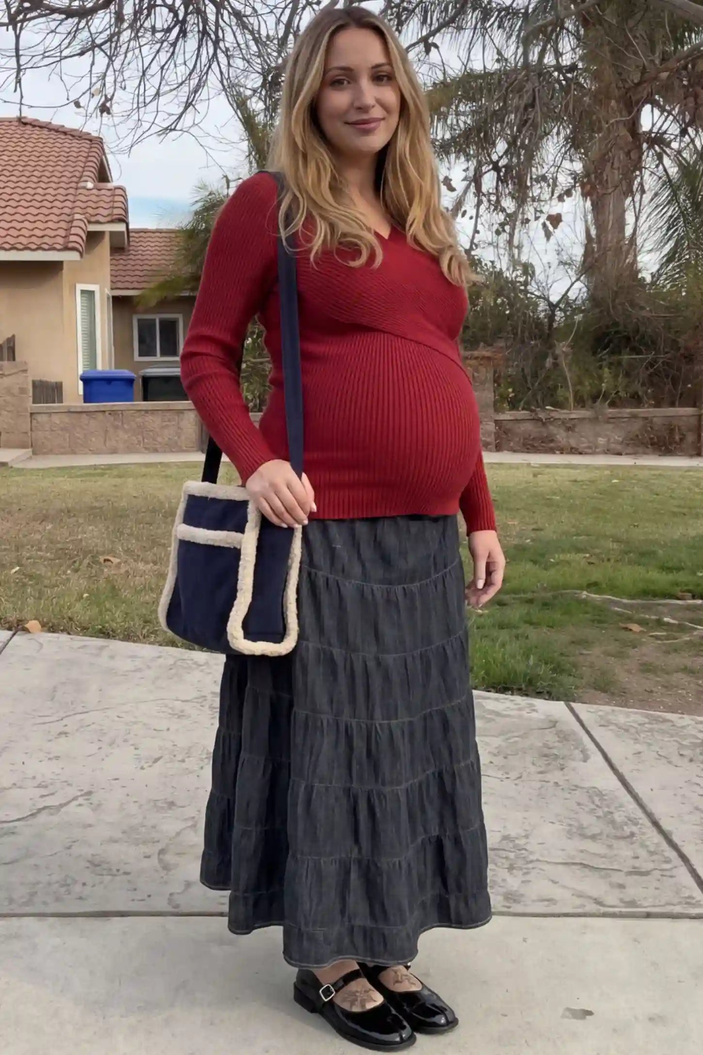 Cross-Over Ribbed Knit Maternity & Nursing Top Cross-Over Ribbed Knit Maternity & Nursing Top in Red featuring a wrap neckline and textured finish on a pregnant woman, front view.