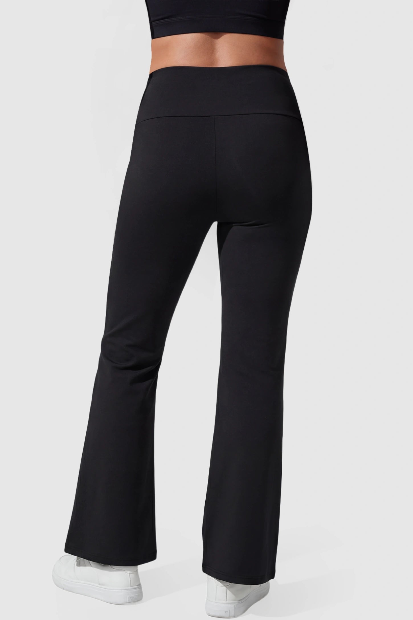 Cross Over High-Waisted Wide-Leg Maternity Pants Cross Over High-Waisted Wide-Leg Maternity Pants in Black featuring V-shaped peach-like buttock styling on a pregnant model back view.