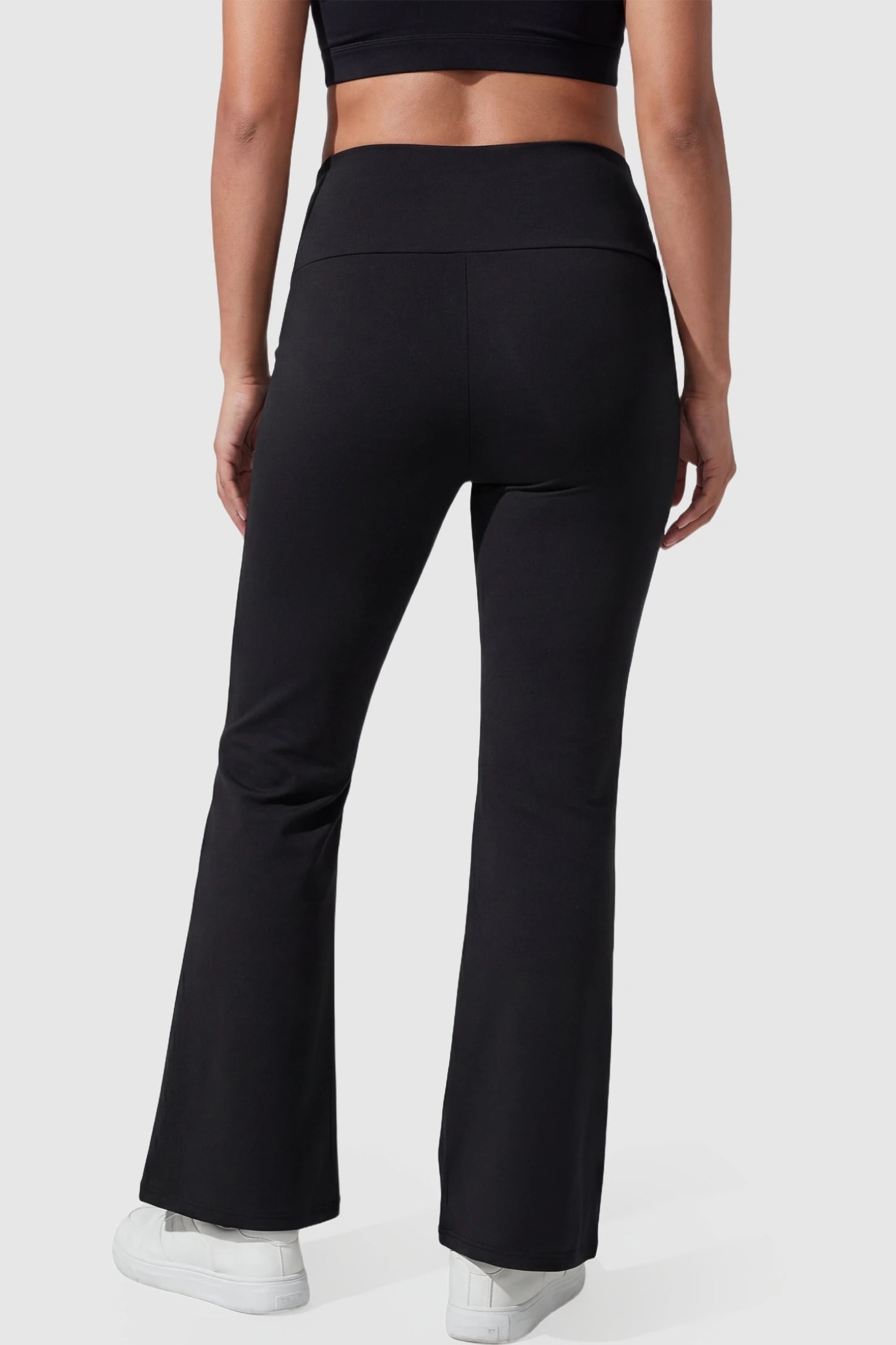 Cross Over High-Waisted Wide-Leg Maternity Pants Cross Over High-Waisted Wide-Leg Maternity Pants in Black featuring V-shaped peach-like buttock styling on a pregnant model from the back.
