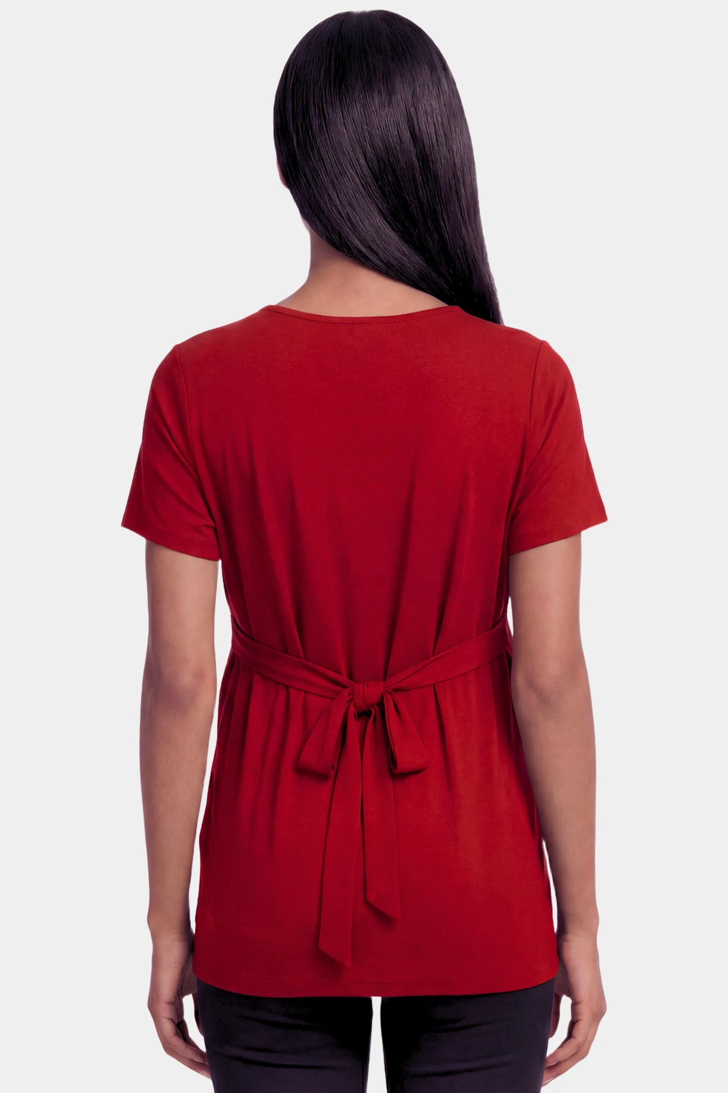 Crossover Short Sleeve Maternity & Nursing Top Crossover Short Sleeve Maternity & Nursing Top in burgundy featuring a crossover V-neck and empire waist on a pregnant model.