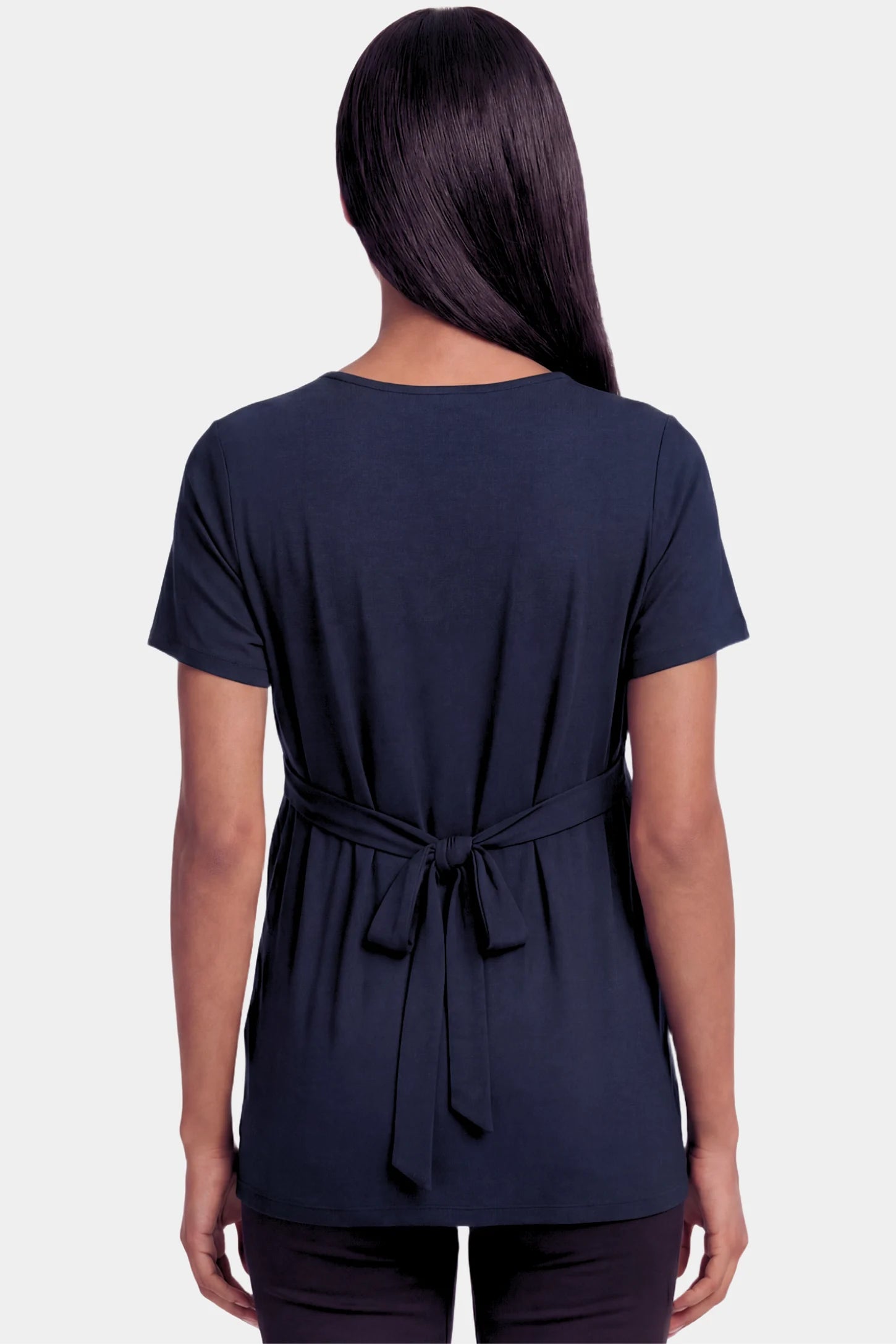Crossover Short Sleeve Maternity & Nursing Top Crossover Short Sleeve Maternity & Nursing Top in dark blue featuring a crossover V-neck and empire waist on a pregnant model.
