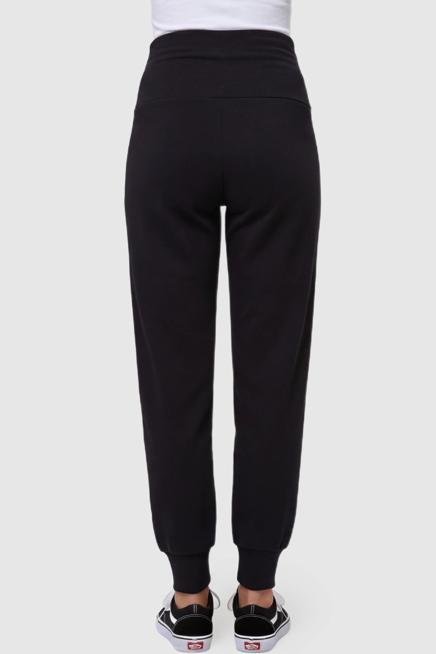 High-Rise Cuffed Maternity Joggers High-Rise Cuffed Maternity Joggers in black featuring over-the-belly support and ribbed cuff hem on pregnant model back view.