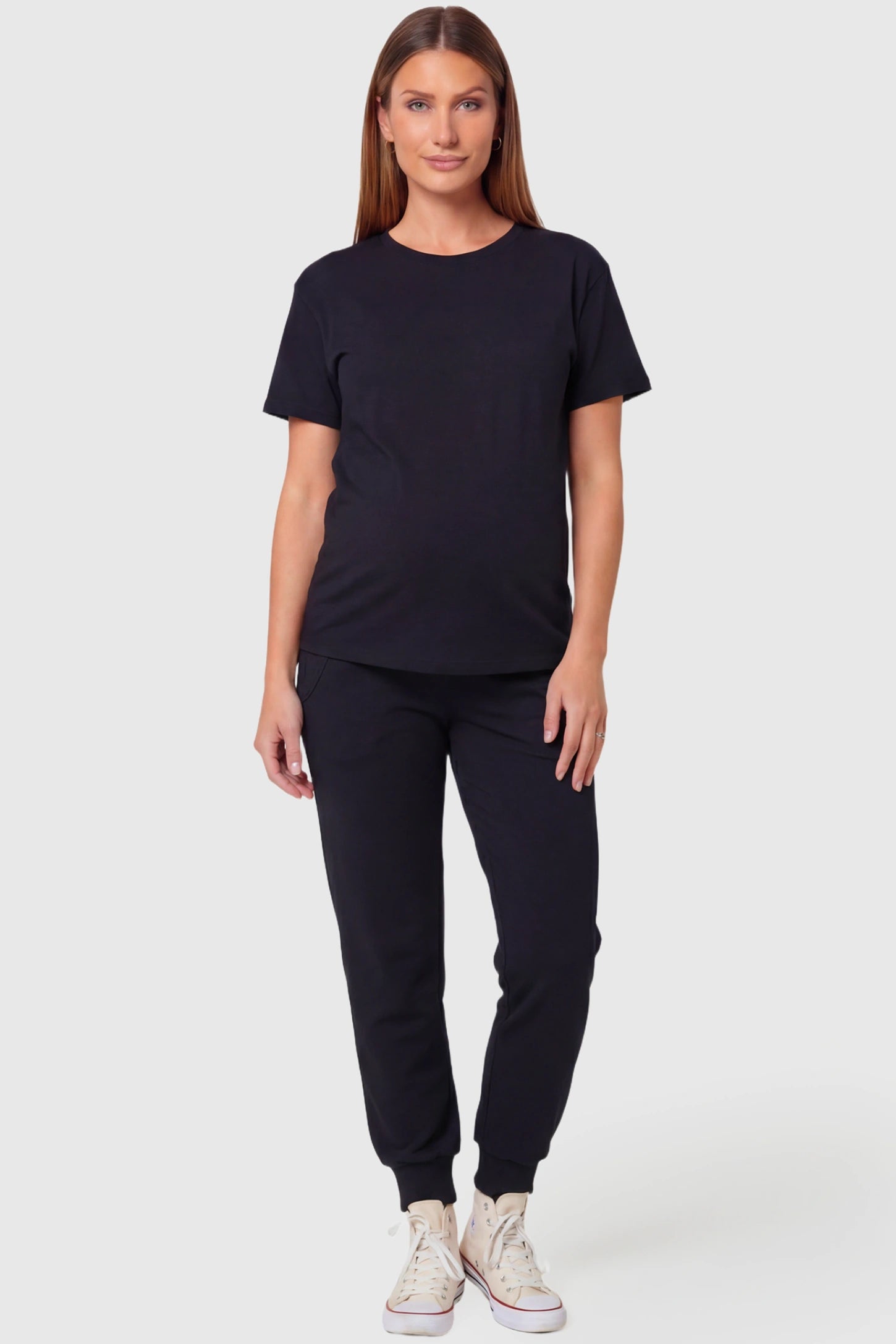 High-Rise Cuffed Maternity Joggers High-Rise Cuffed Maternity Joggers in black featuring ribbed cuff hem on pregnant model.