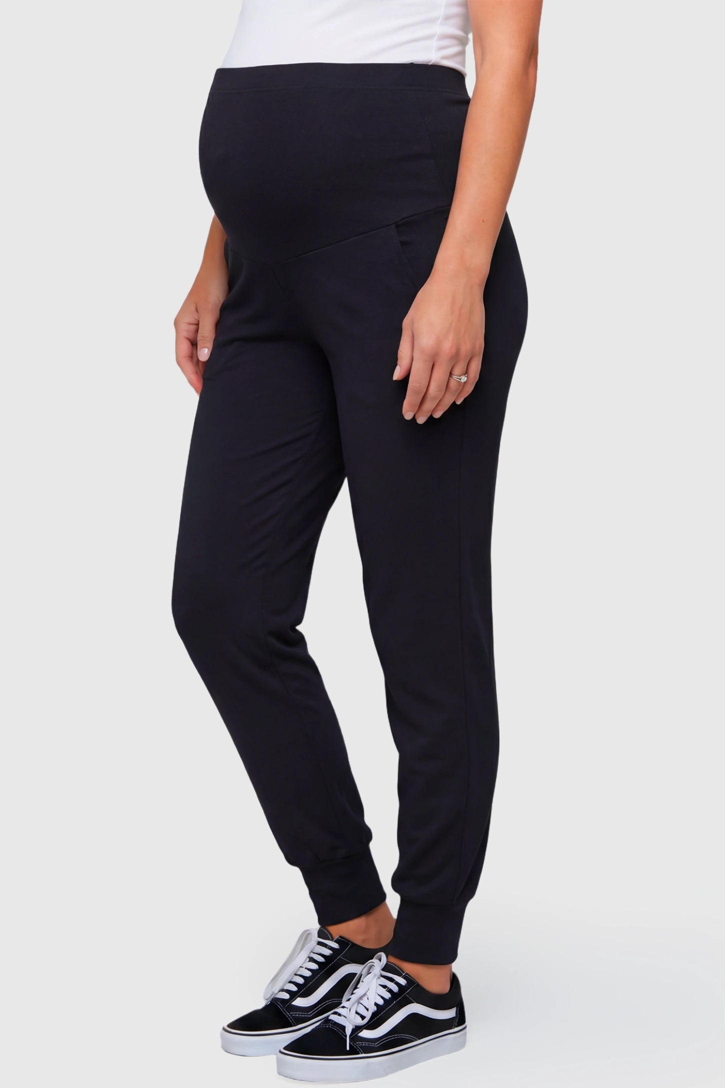 High-Rise Cuffed Maternity Joggers High-Rise Cuffed Maternity Joggers in black featuring over-the-belly support and ribbed cuff hem on pregnant model.