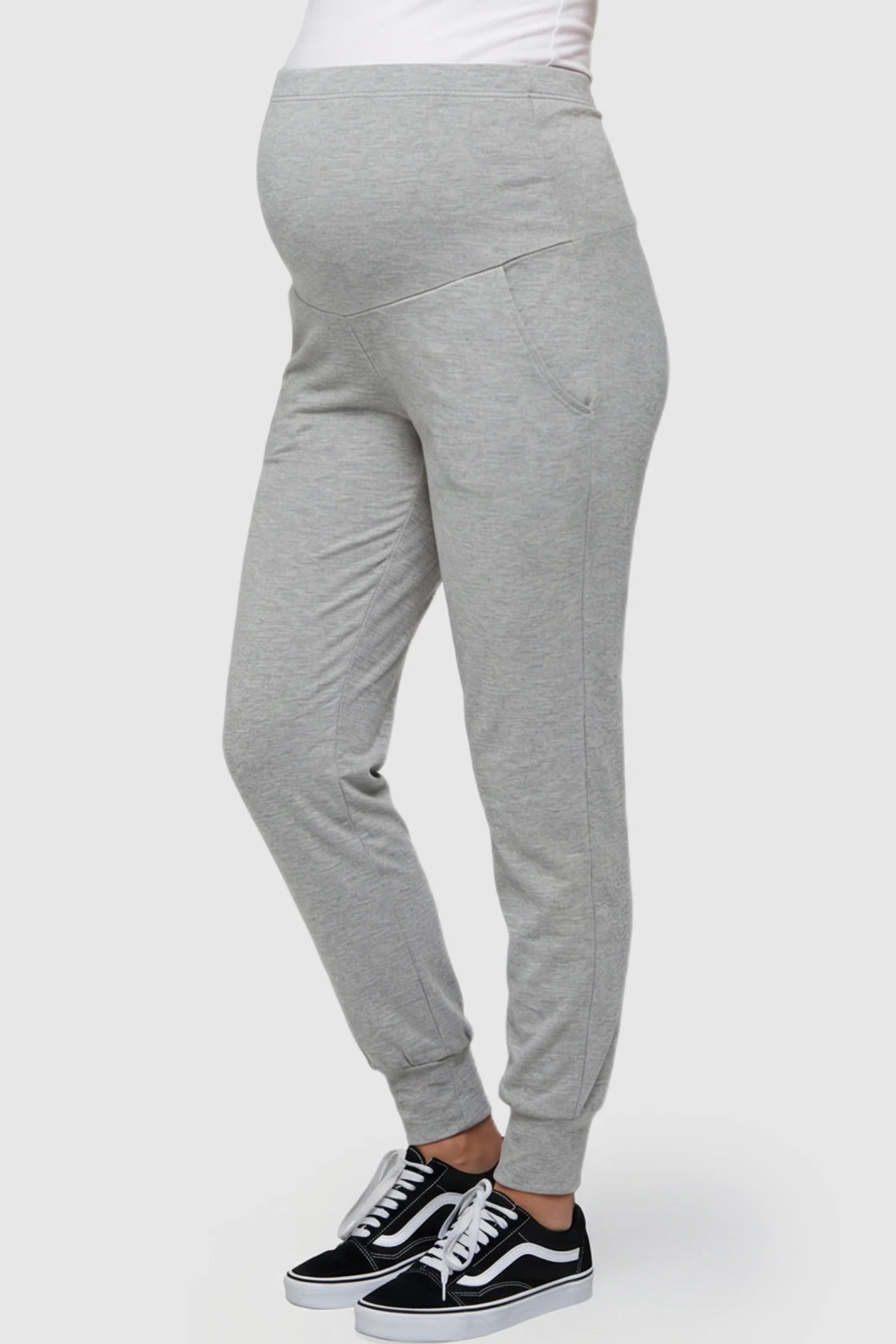 High-Rise Cuffed Maternity Joggers High-Rise Cuffed Maternity Joggers in gray featuring over-the-belly support and ribbed cuff hem on pregnant model side view.