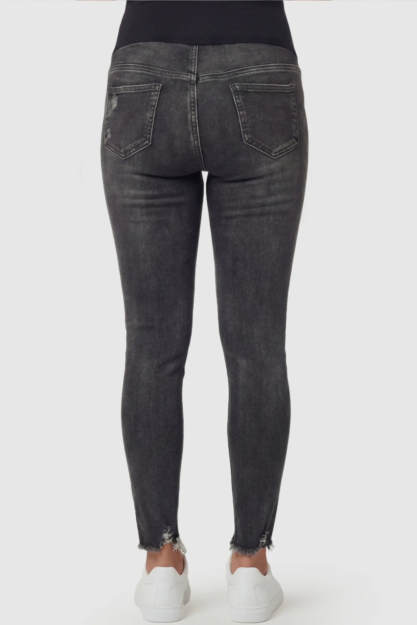 Frayed Hem Distressed Cropped Slim-Fit Maternity Jeans Frayed hem distressed cropped slim-fit maternity jeans in black with rear pocket detail, back view on pregnant model