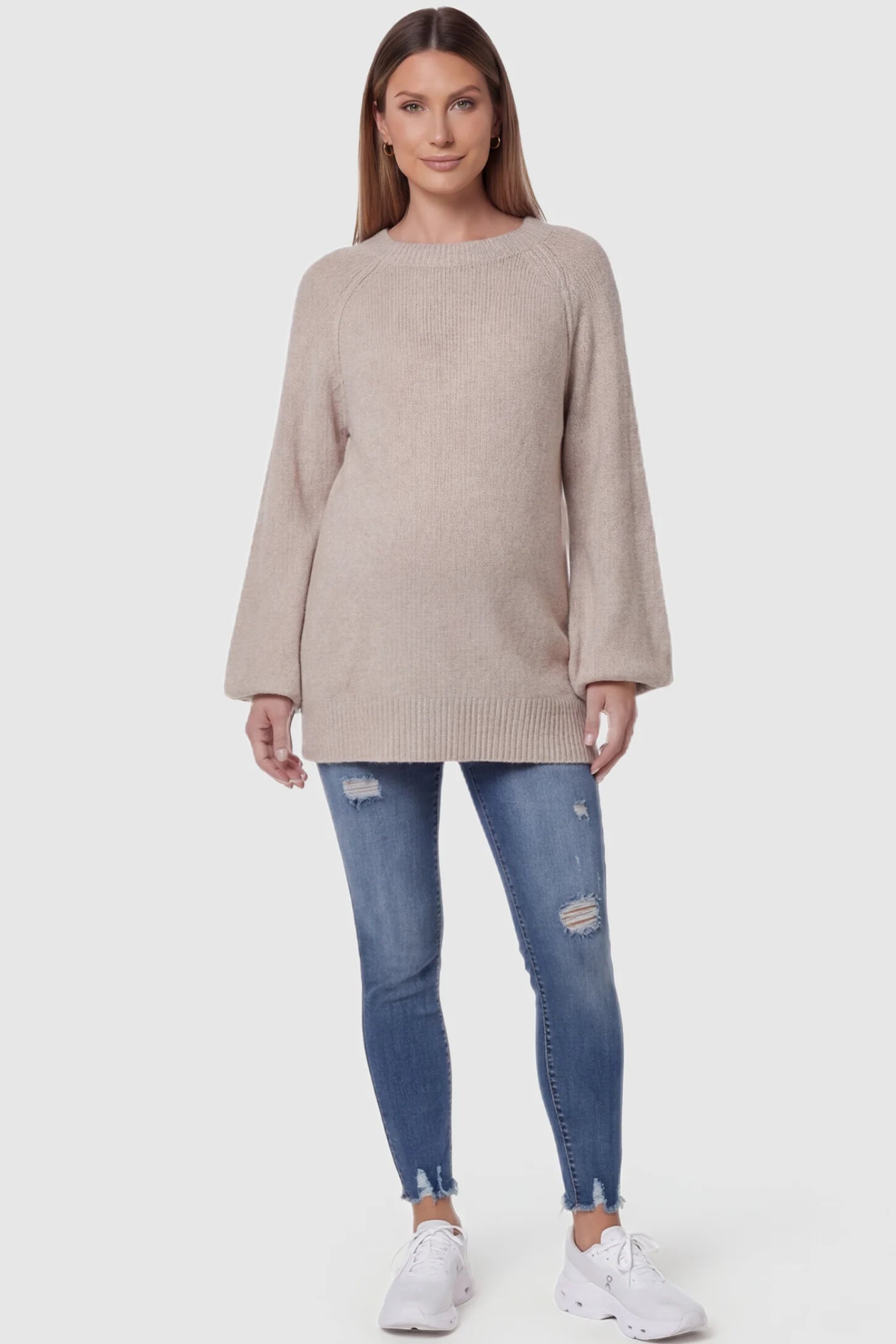 High-Rise Distressed Skinny Maternity Jeans High-Rise Distressed Skinny Maternity Jeans in navy blue featuring over-the-belly support panel and frayed hem on a front view pregnant model.