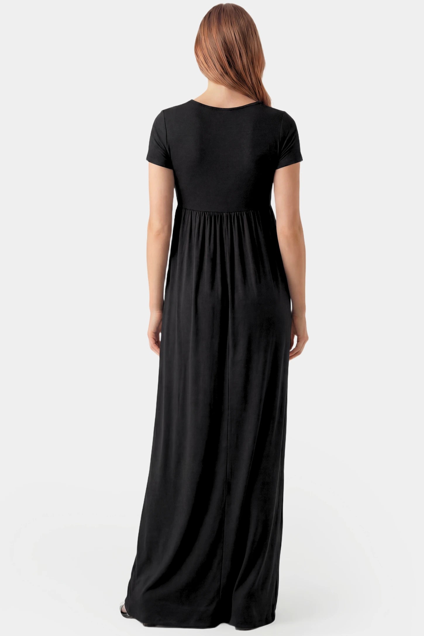 Crossover Draped Maternity & Nursing Maxi Dress Crossover Draped Maternity & Nursing Maxi Dress in black featuring a flowy empire waist silhouette on a pregnant model.