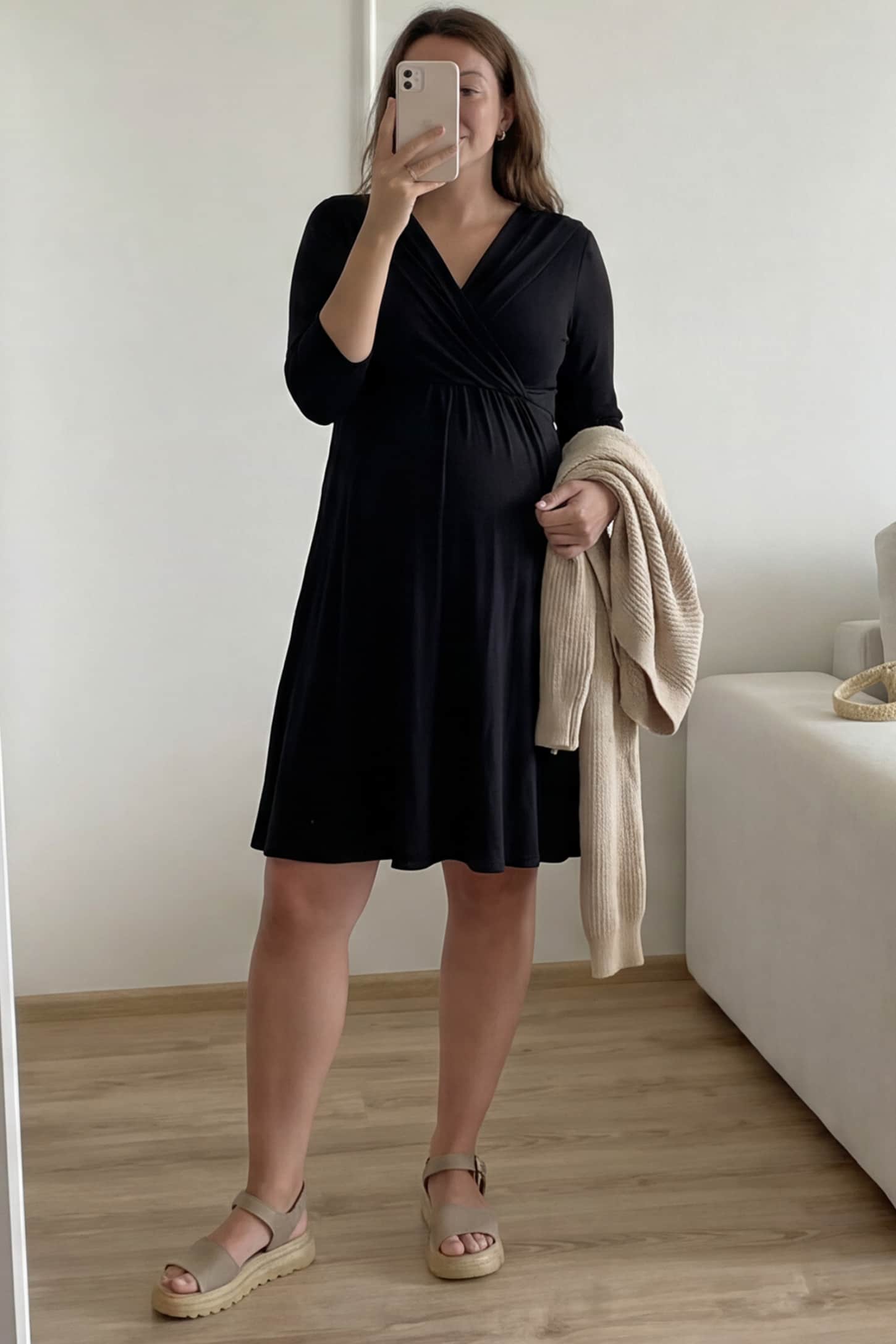 Crossover A-Line Maternity & Nursing Midi Dress Crossover A-Line Maternity & Nursing Midi Dress in black featuring wrap V-neck bodice and flowy midi skirt on pregnant model.