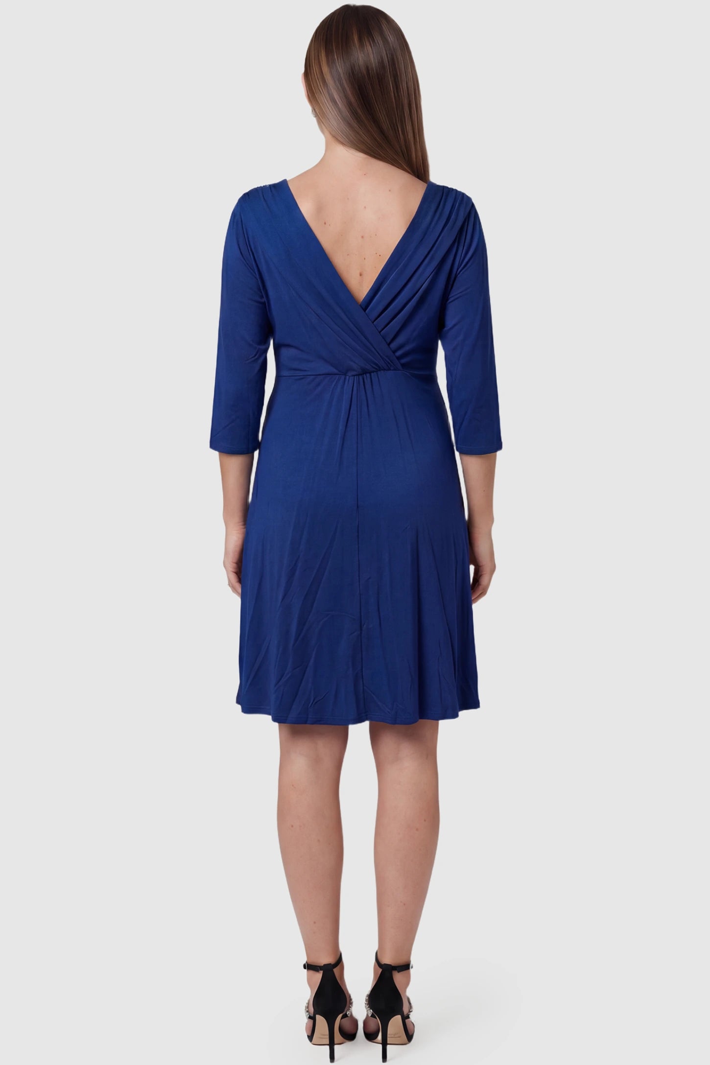 Crossover A-Line Maternity & Nursing Midi Dress Crossover A-line maternity & nursing midi dress in navy blue with soft pleated drape, back view on pregnant model
