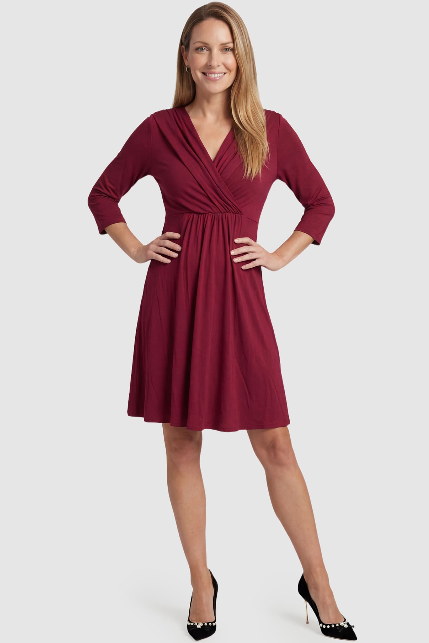 Crossover A-Line Maternity & Nursing Midi Dress Crossover A-Line Maternity & Nursing Midi Dress in red featuring wrap V-neck bodice and flowy midi skirt on non pregnant model.