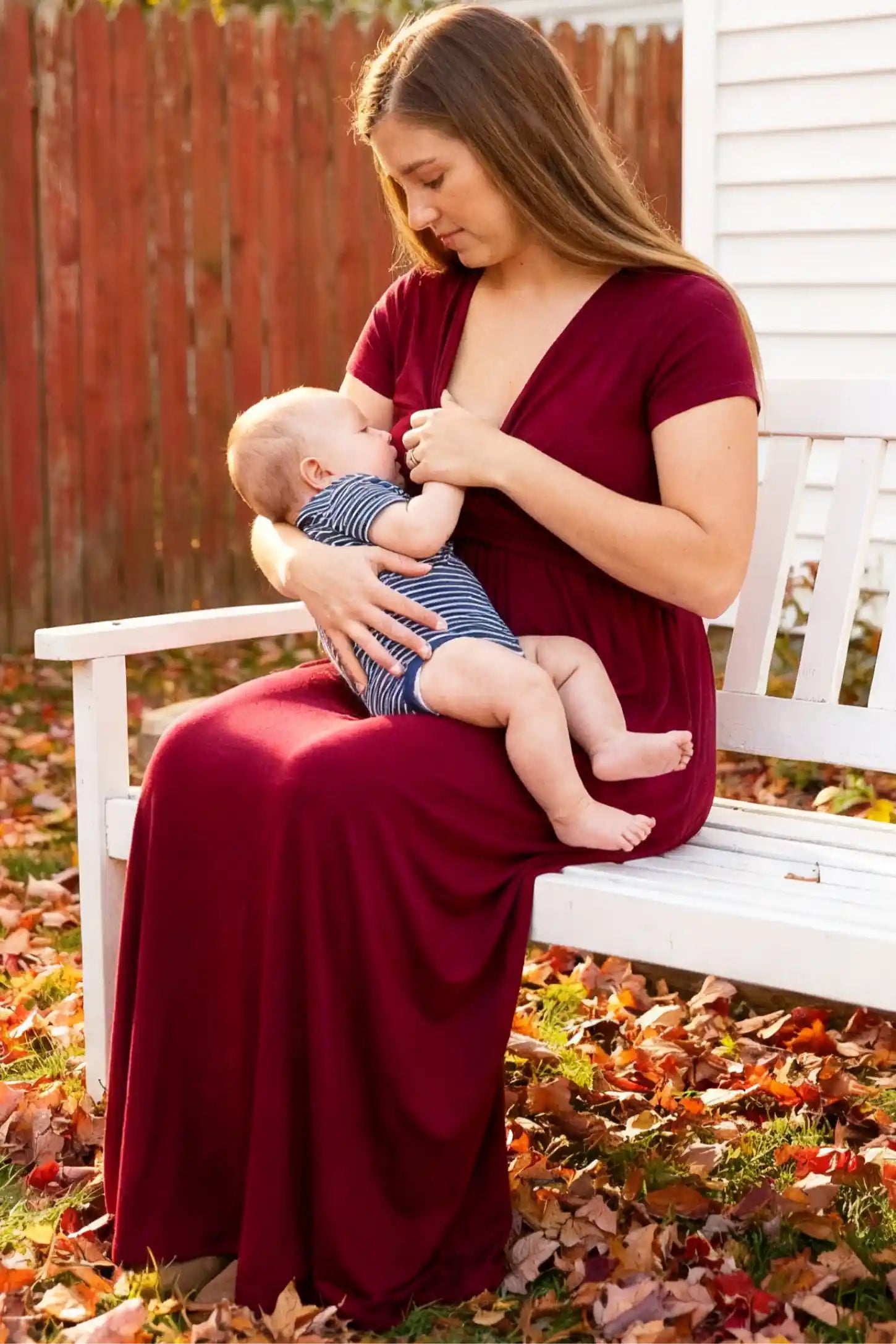 Crossover Draped Maternity & Nursing Maxi Dress Crossover Draped Maternity & Nursing Maxi Dress in red wine featuring a flowy empire waist silhouette on a non pregnant model.