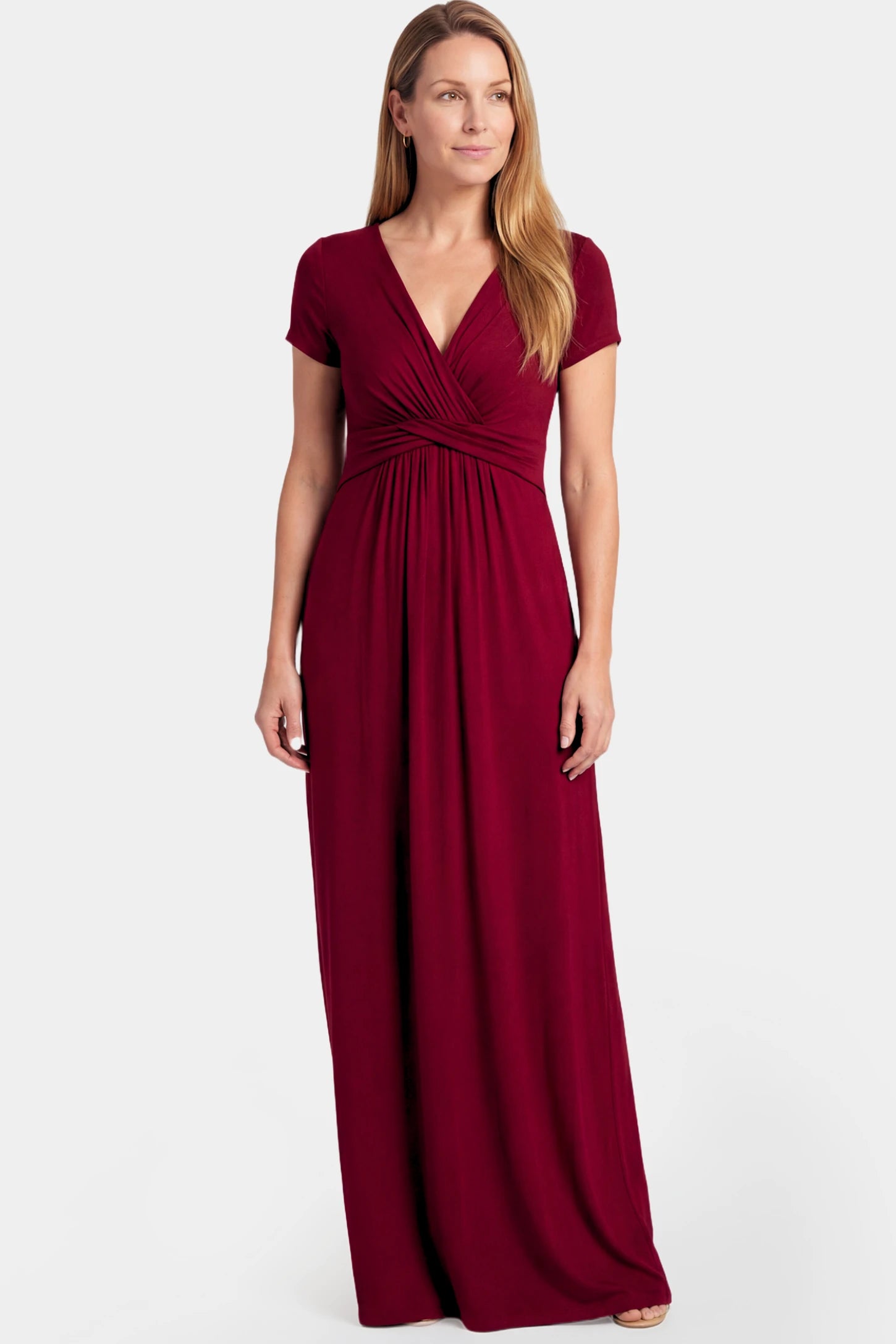 Crossover Draped Maternity & Nursing Maxi Dress Crossover Draped Maternity & Nursing Maxi Dress in red wine featuring a V-neck crossover design and flowy empire waist silhouette on a non pregnant model.
