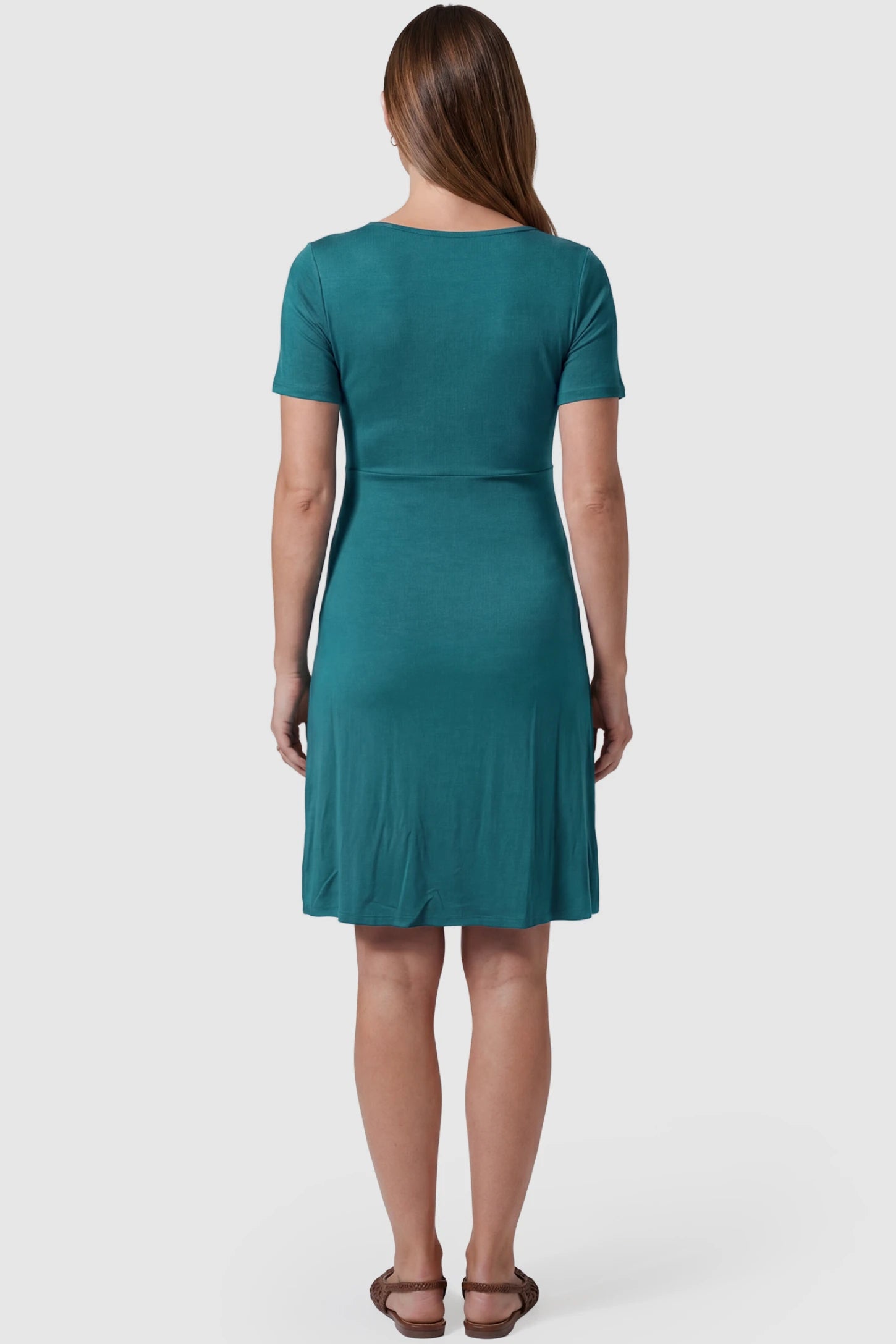 Drawstring Bow Front A‑Line Maternity Short Dress Drawstring bow front A-line maternity short dress in teal green with flowy A-line silhouette, back view on pregnant model