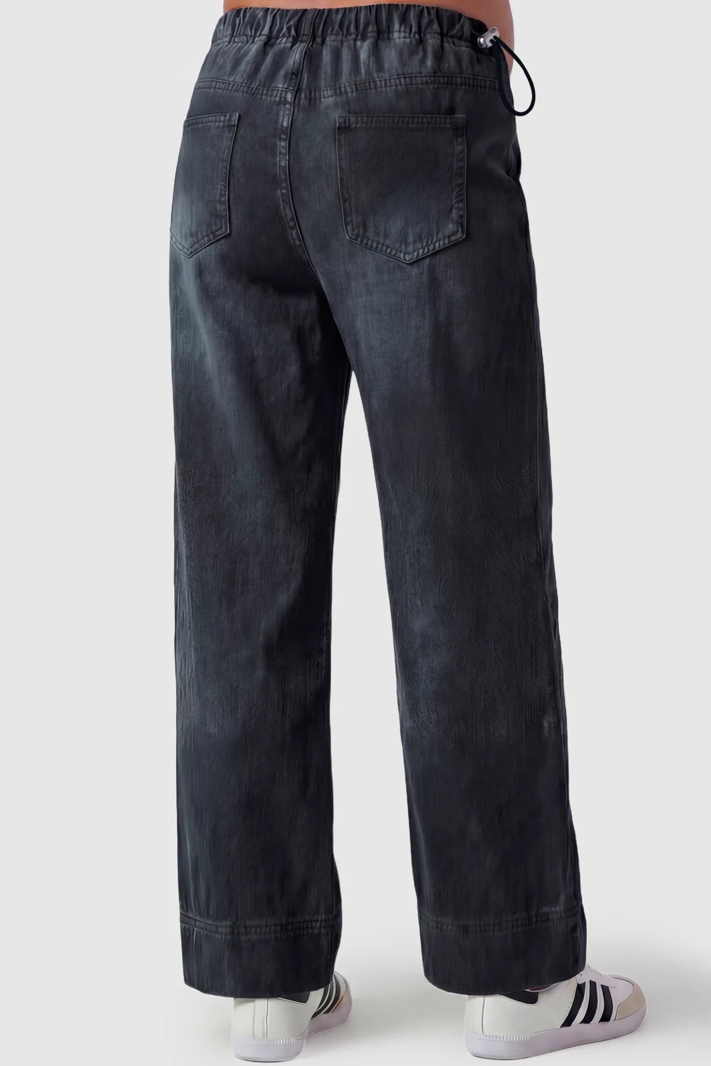 Drawstring Wide-Leg Maternity Jeans Drawstring Wide-Leg Maternity Jeans in black featuring adjustable waist and relaxed full-length silhouette on pregnant model back view.